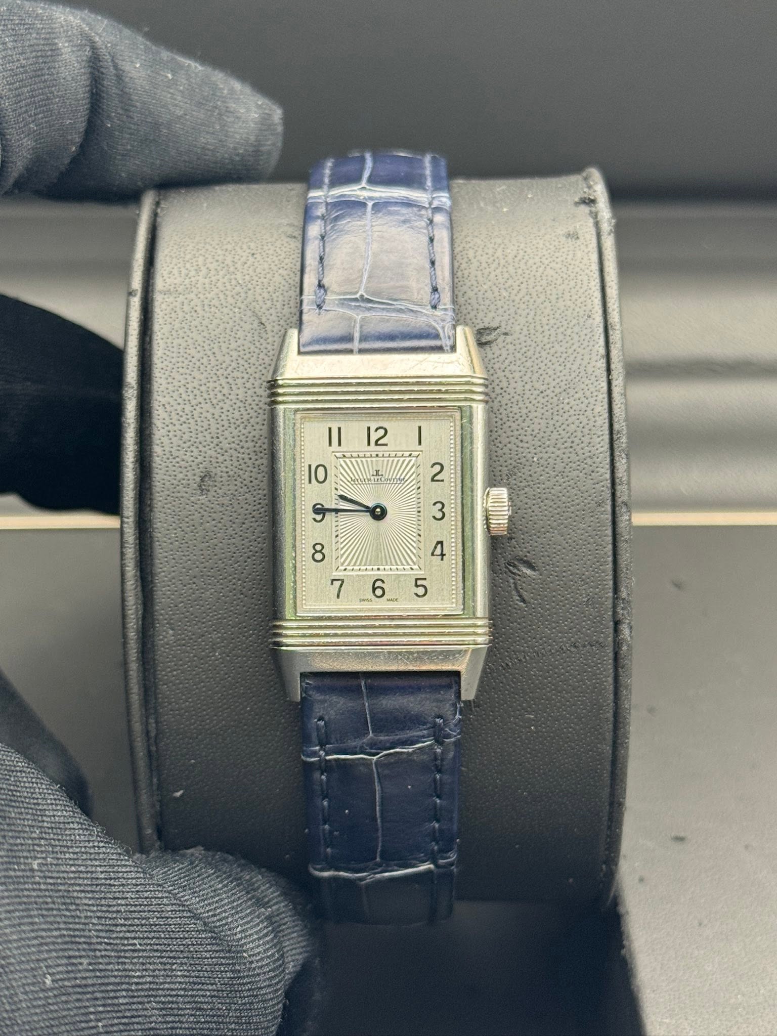 May be an image of wrist watch and text