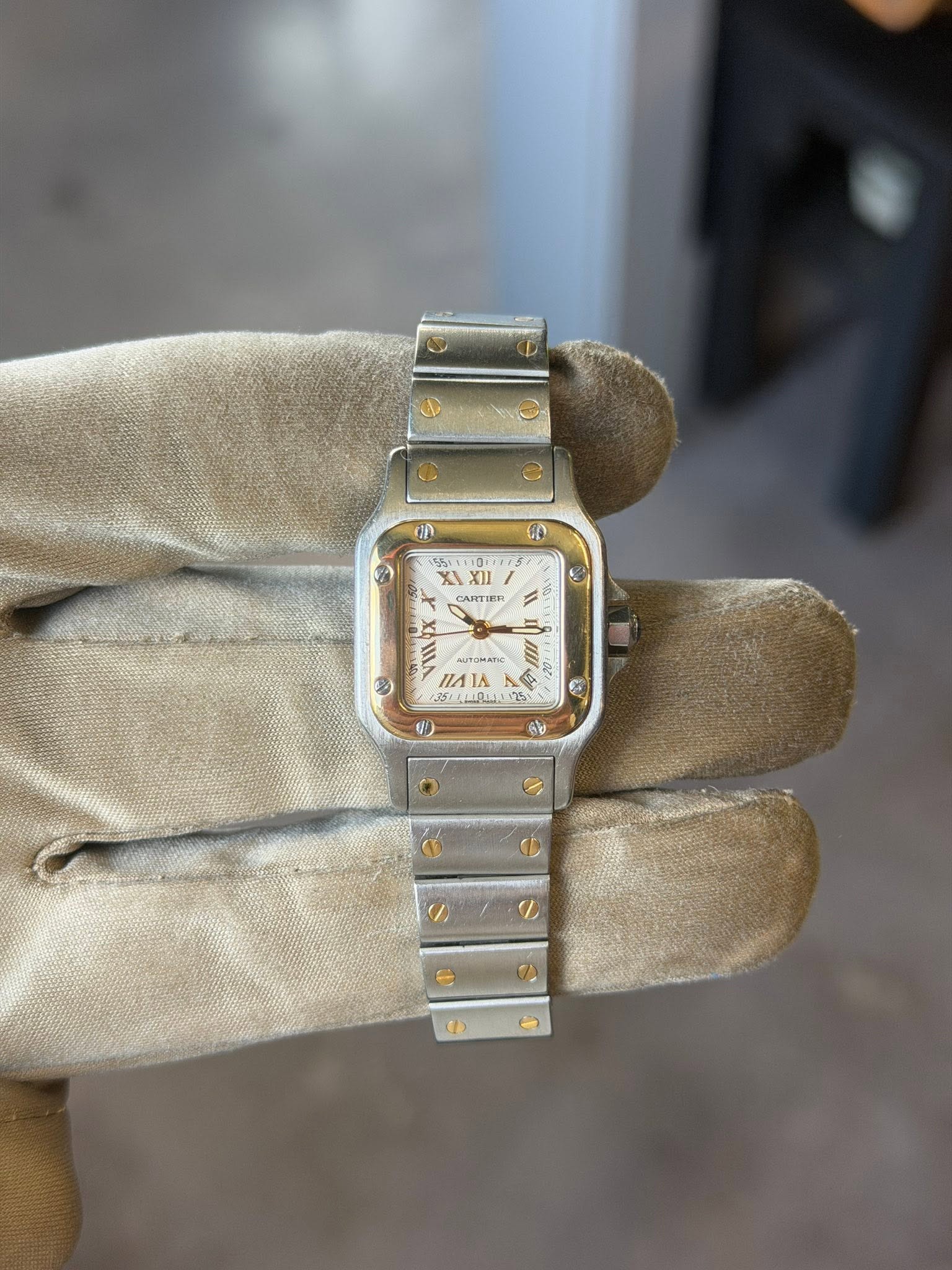 May be an image of wrist watch and text