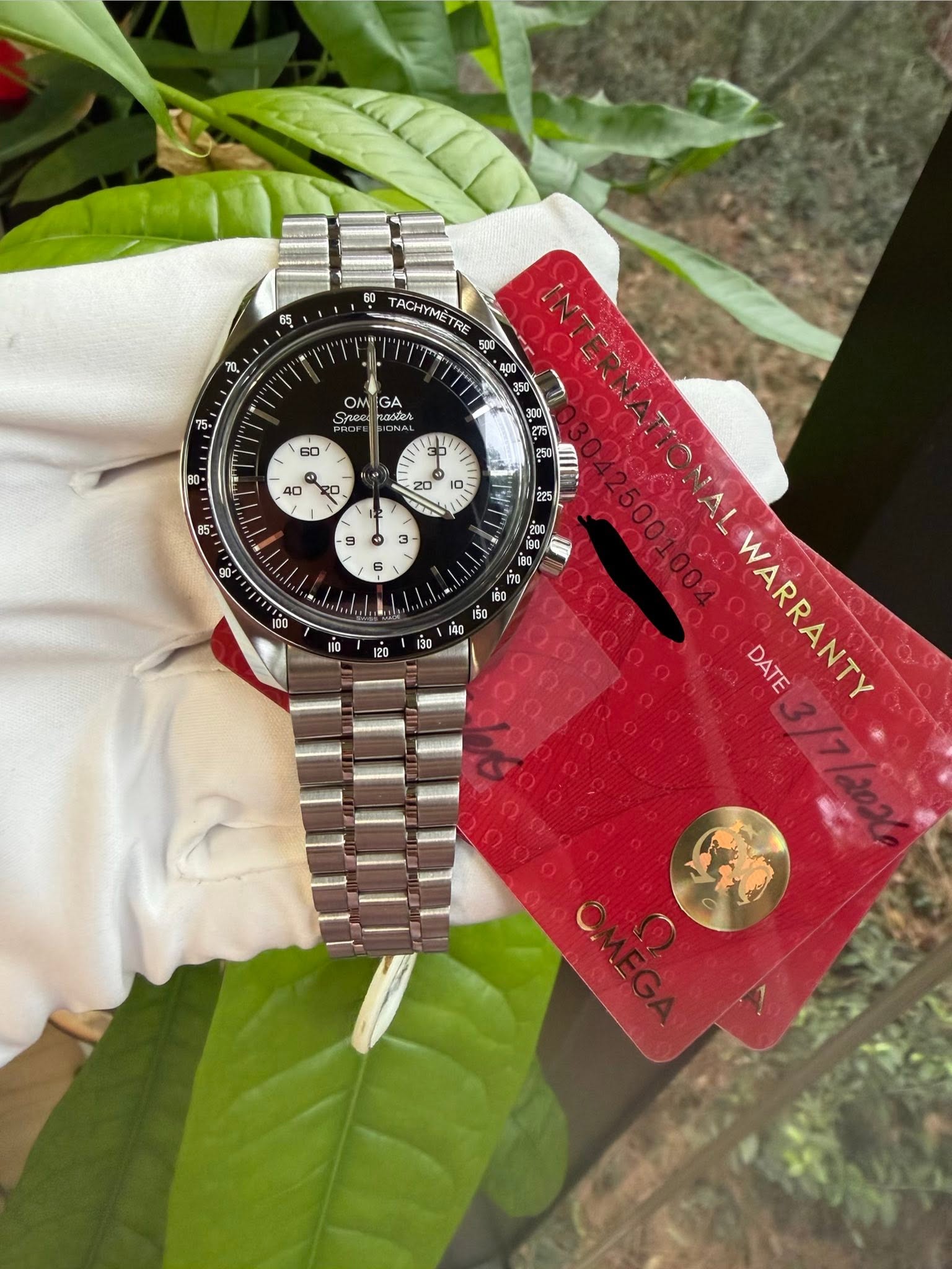 May be an image of wrist watch and text that says 'វុ ل 60 TACHy TACHYMETRE TRE 500 4DT 00 $50 후 ON GA Srnee adias - ទុ 9 3 8 ig0 នើង 2ై01 វណ WARRANTY DATE'