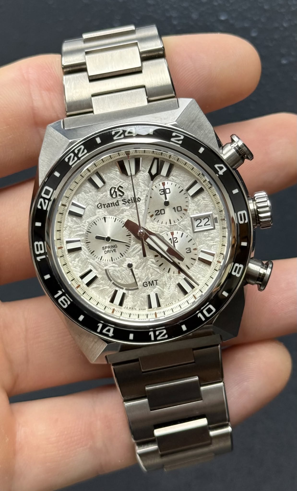 May be an image of wrist watch and text that says ' 6S Grand Seiko ဒ T" SPRIE SPRING DRIVE の 12 3 GM 90 = ול ミ 1 ج Z'