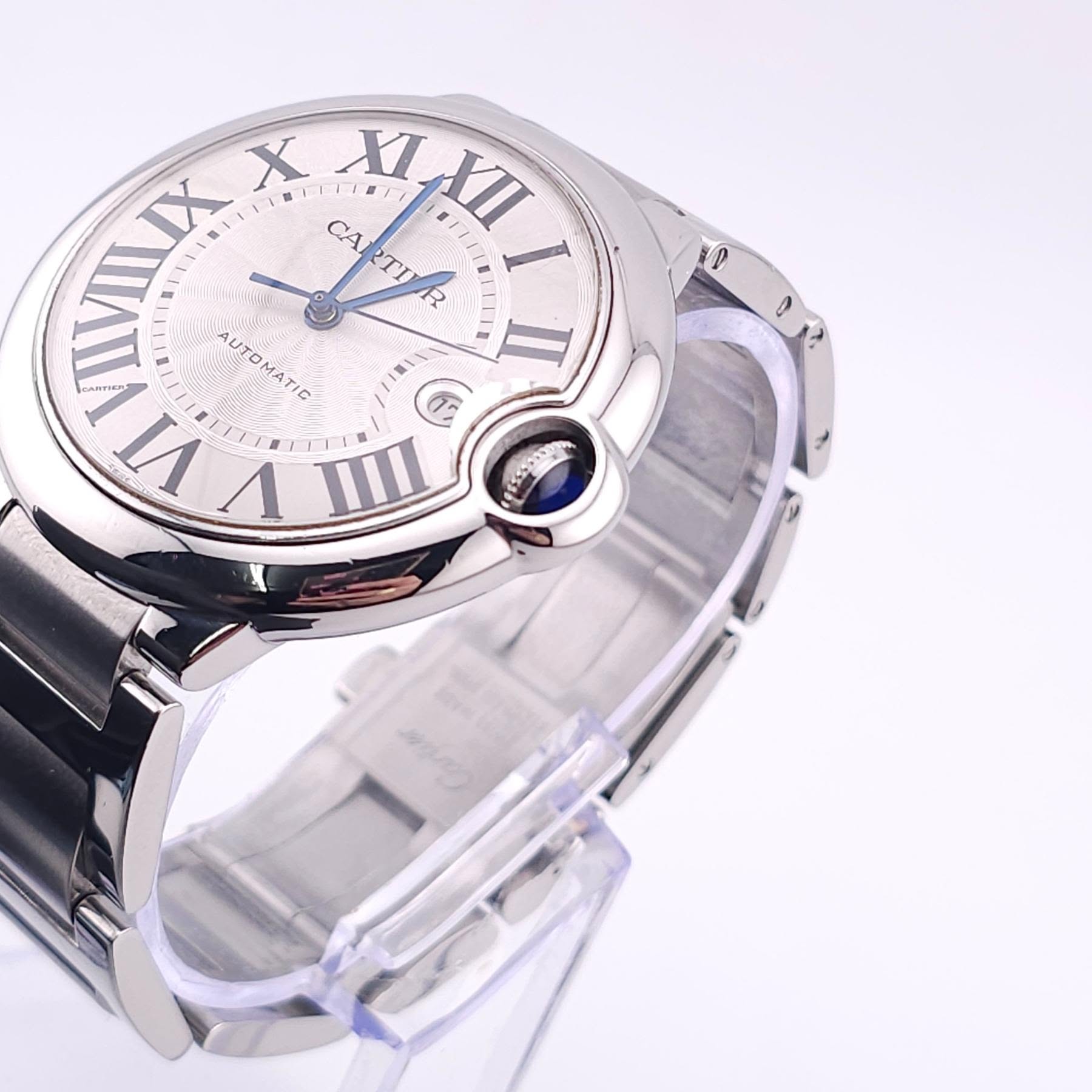 May be an image of wrist watch and text that says 'IVII IIX IX X CARRTINR CAI STTTS XLII XI VII I AHTOATI AUTOMATIC ን/ n VT V 10 6'
