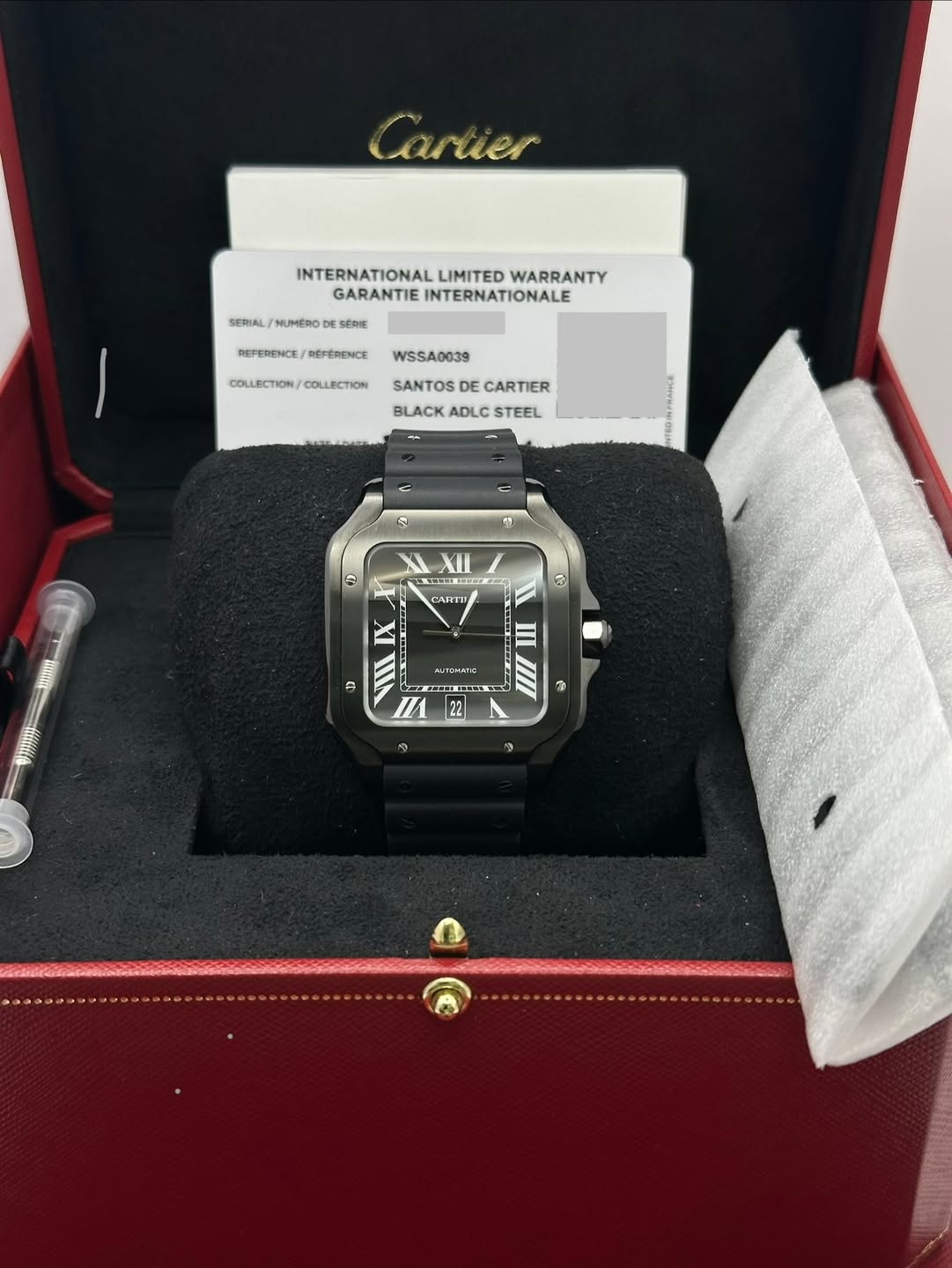 May be an image of digital watch and text that says 'Cartier SERIAL NUMERO INTERNATIONAL INTERNATIONALLIMITEDWARRANT LIMITED WARRANTY GARANTIE ARANTIEINTERNATIONALE INTERNATIONALE…