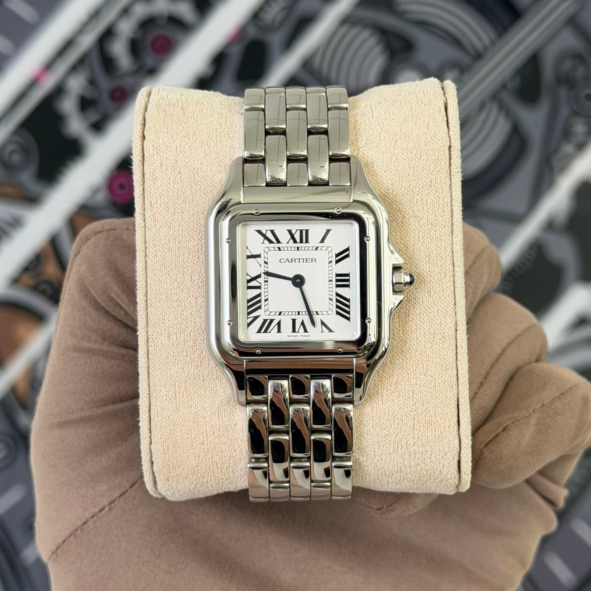 May be an image of wrist watch and text
