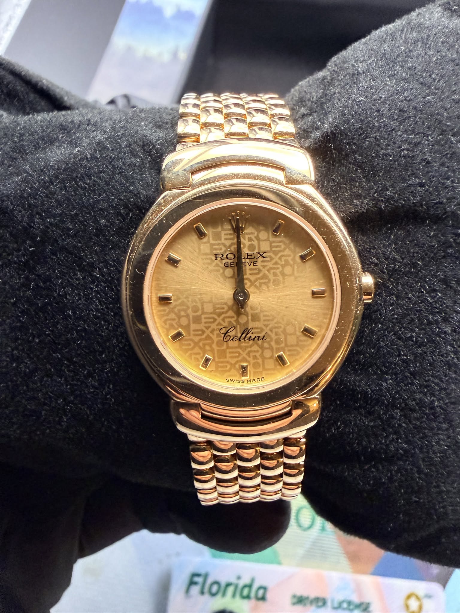 May be an image of wrist watch and text