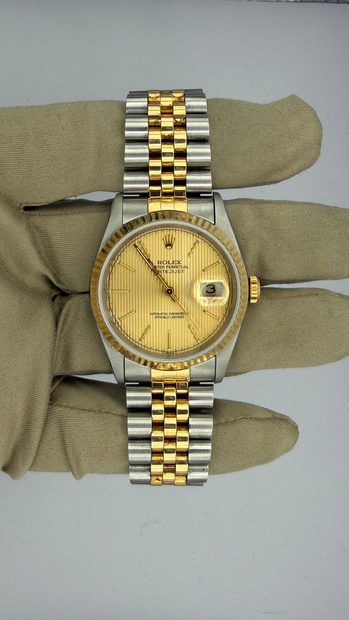 May be an image of wrist watch and text