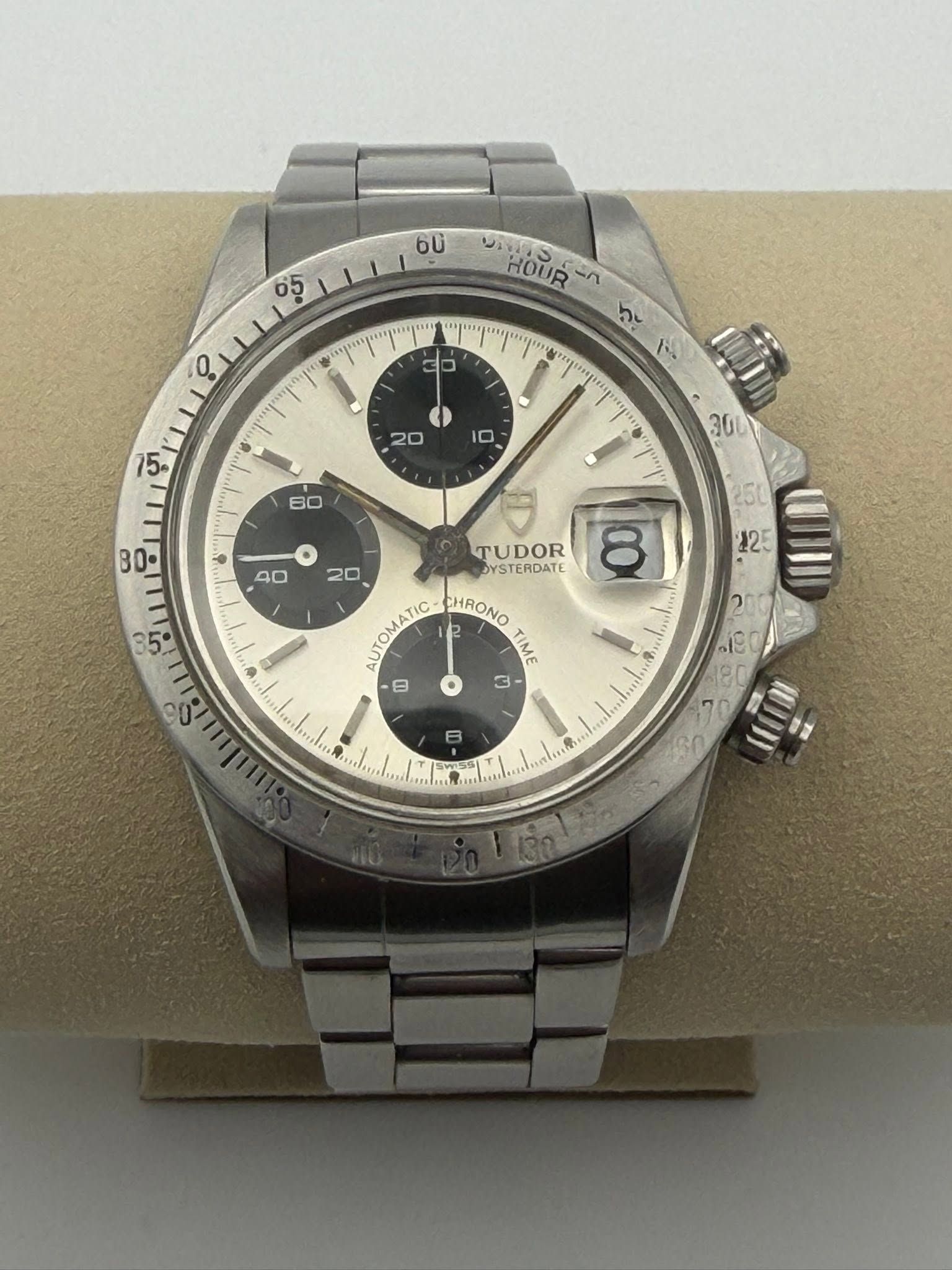 May be an image of wrist watch and text