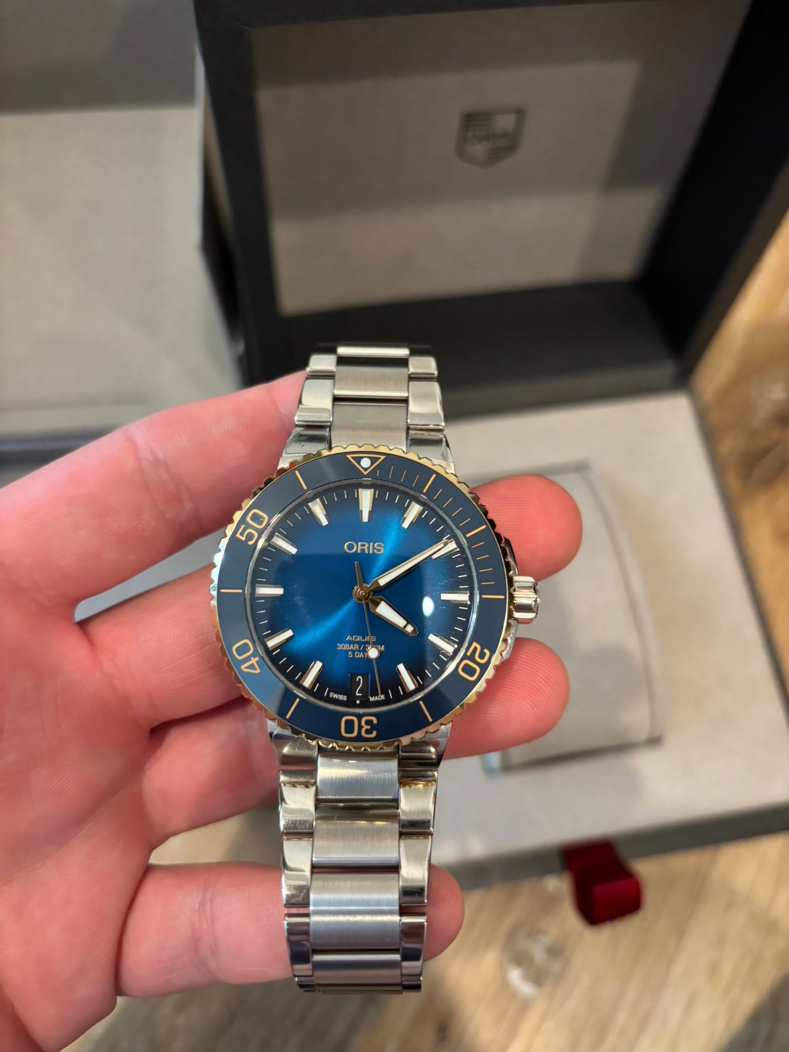 May be an image of wrist watch and text that says '50 ORIS ۳ AOM 40 20 لم 30'