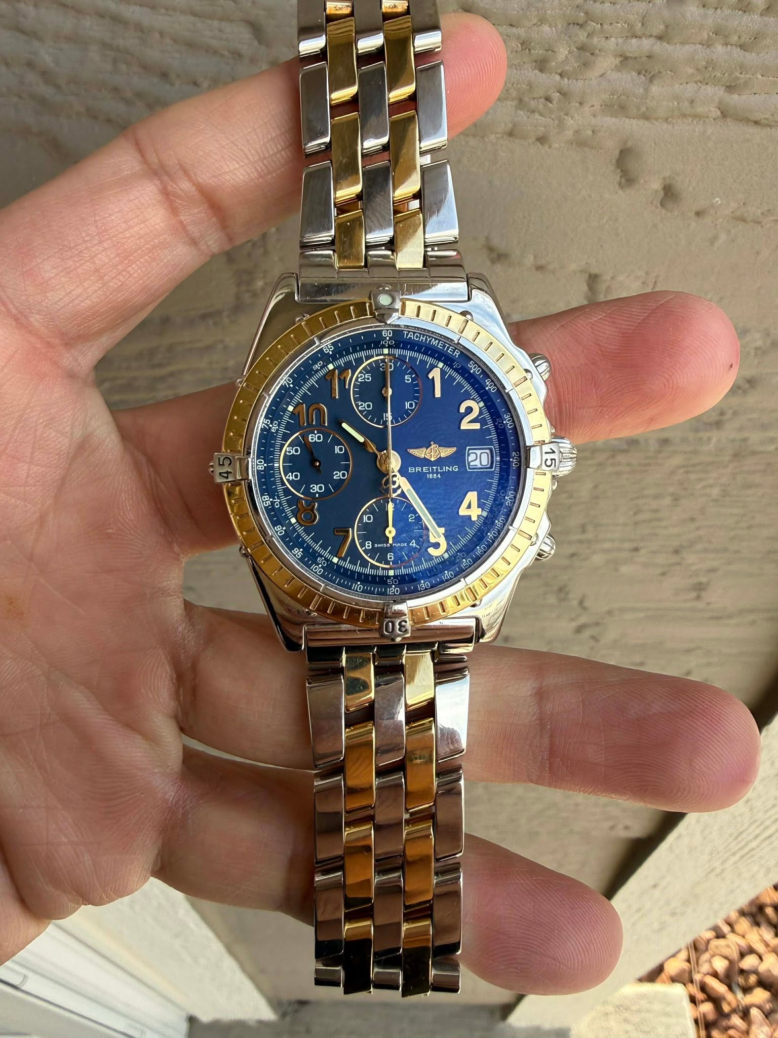 May be an image of wrist watch and text
