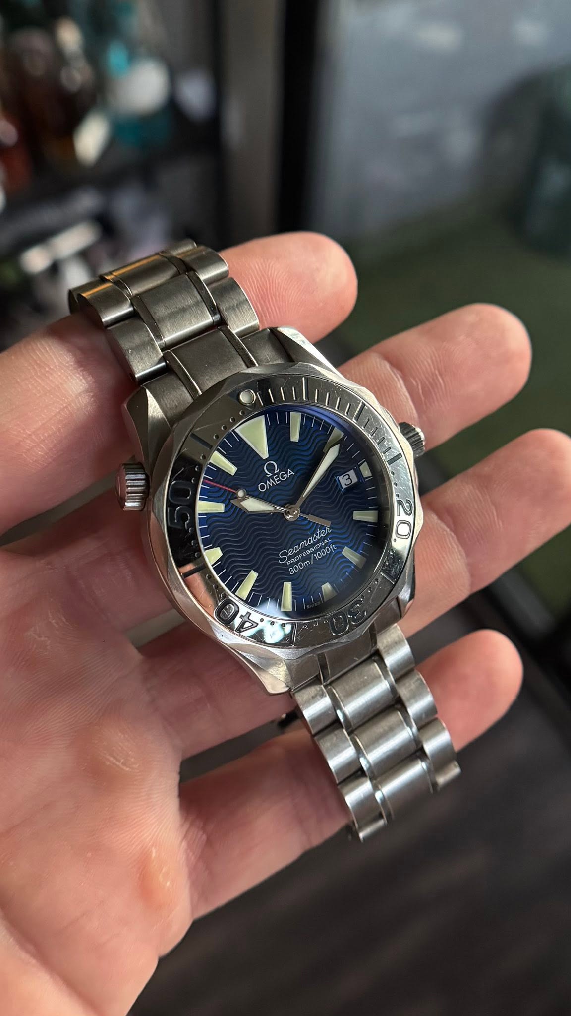 May be an image of wrist watch and text