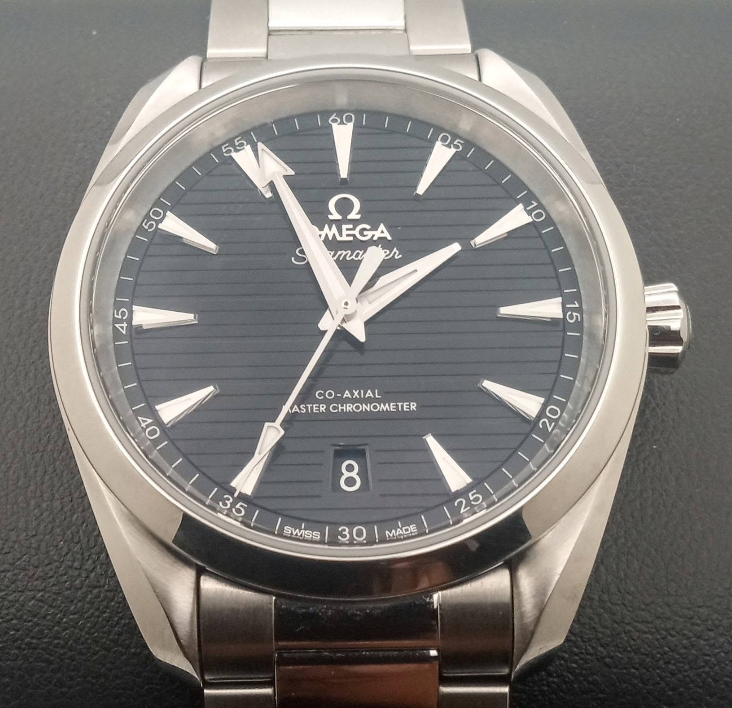 May be an image of wrist watch and text that says ' ח MEGA amaer ama م OV CO- CO-AXIAL- ASTER CHRONOMETER SWISs 30 25 MADE'