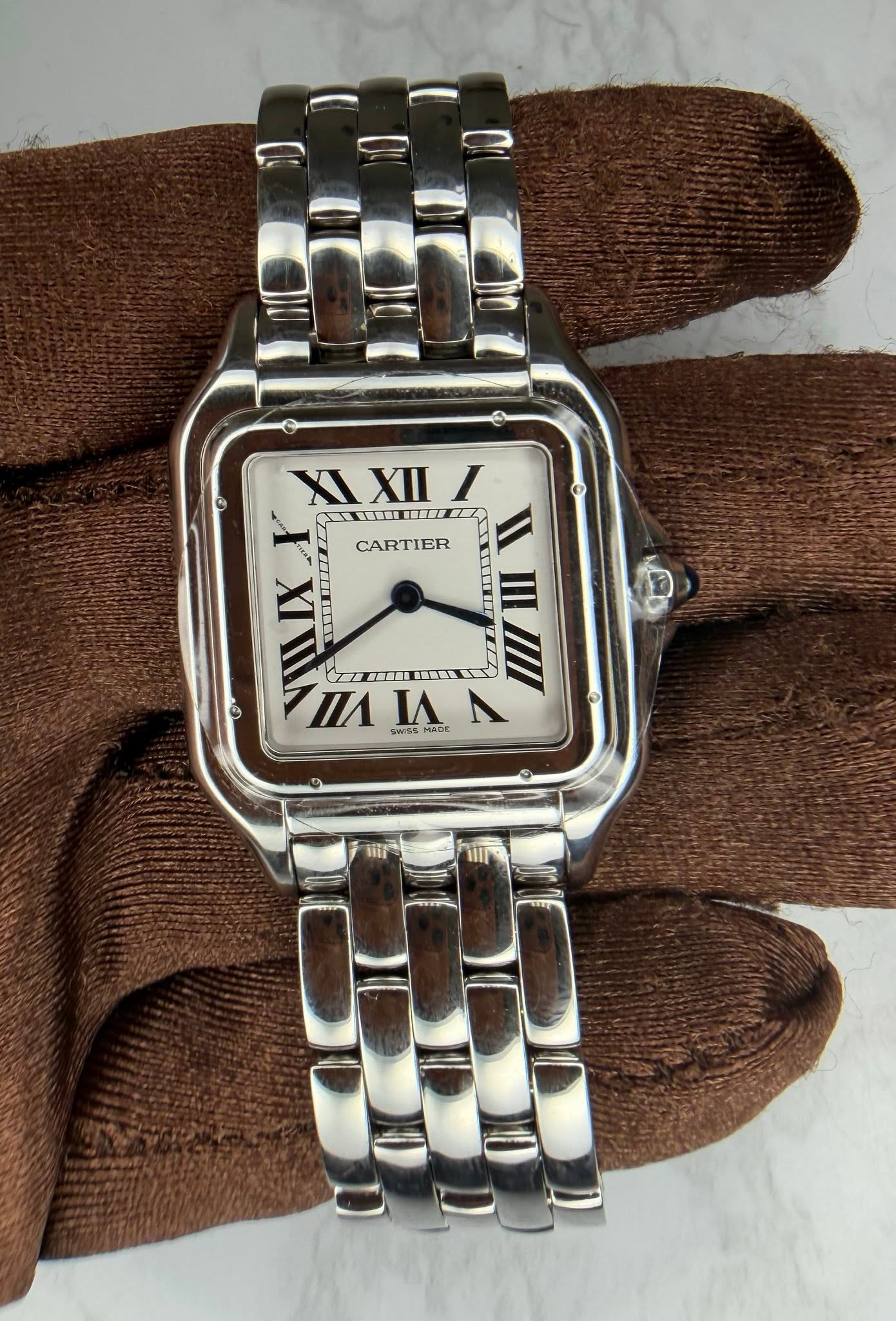 May be an image of wrist watch and text