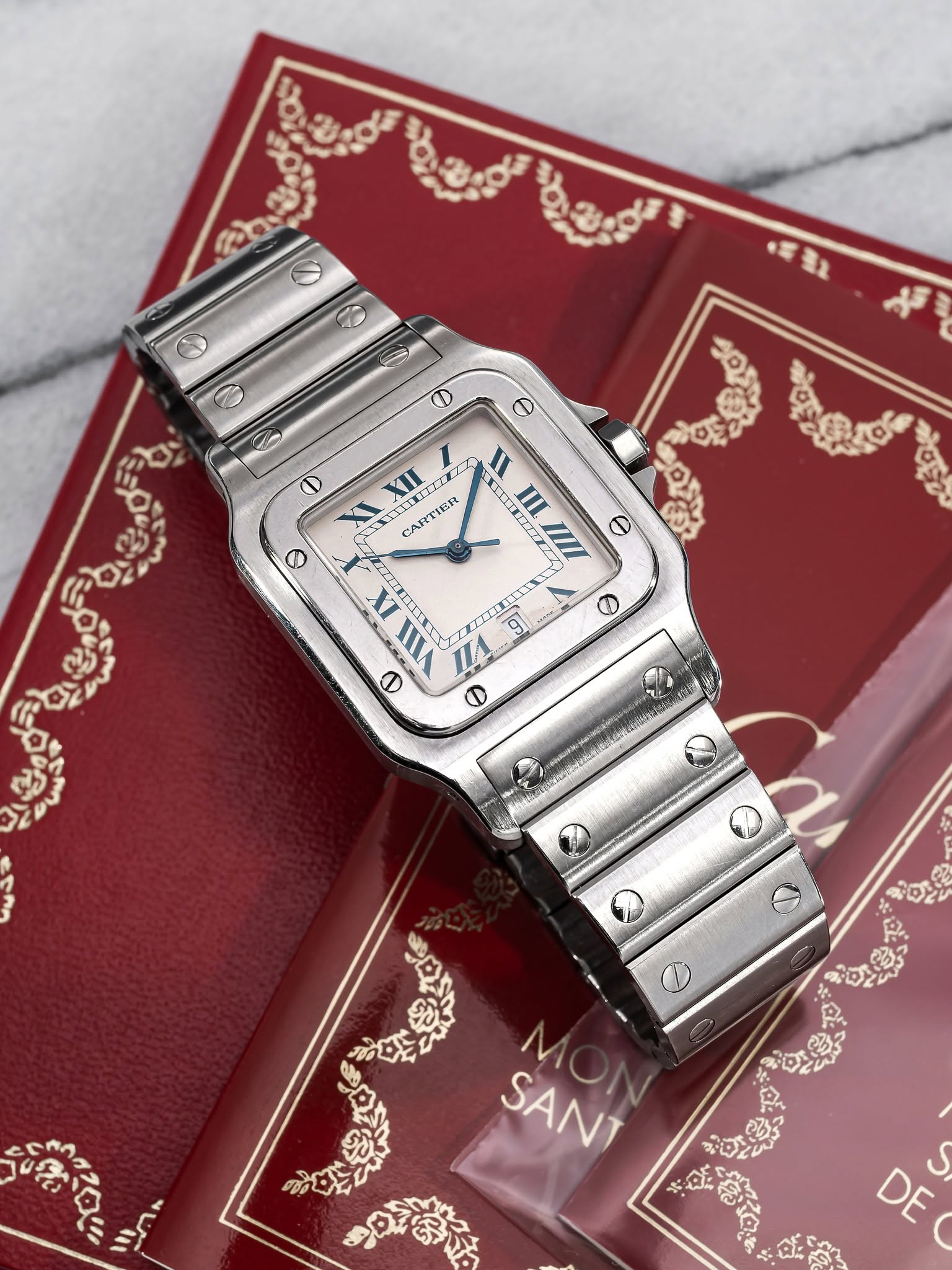 May be an image of wrist watch and text