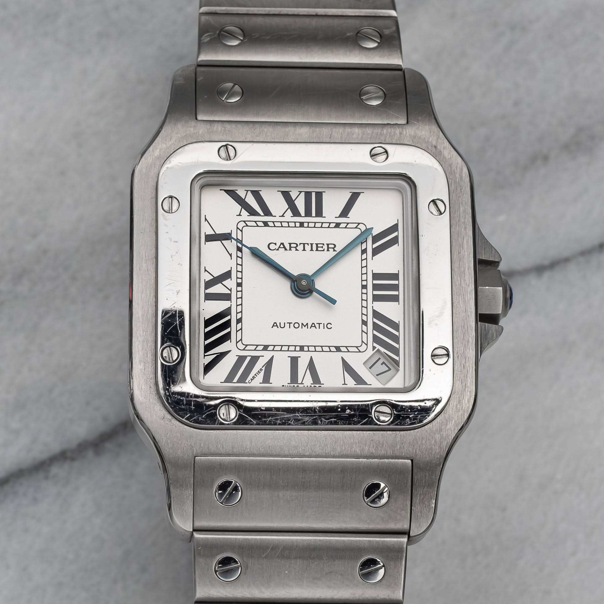 May be an image of digital watch and text that says 'XIXII مم O CARTIER ΑΥΤΟΜΑΤΙ Θ и 1'