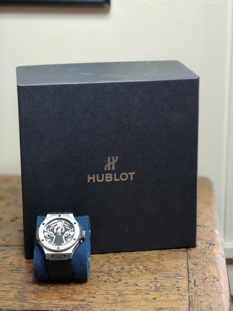 May be an image of wrist watch and text that says 'HUBLOT'
