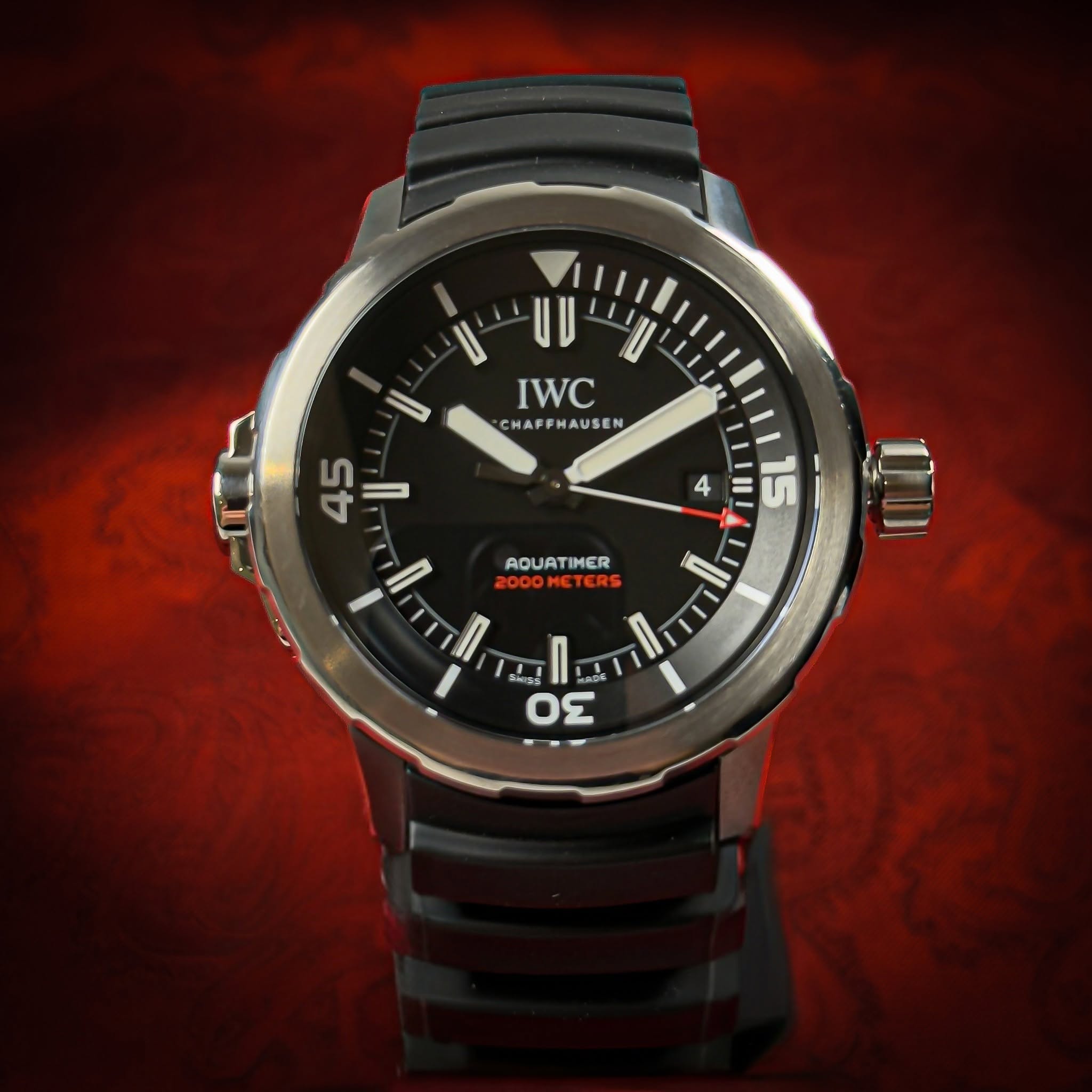 May be an image of wrist watch and text that says '- IWC CHAFFHAUSEN CHA HAFF FM/ AUS AUSE USEN 45 ഗ A 4 15 AQUATIMER IMER ME METERS TERS 00OMETERS I ΟΣ'