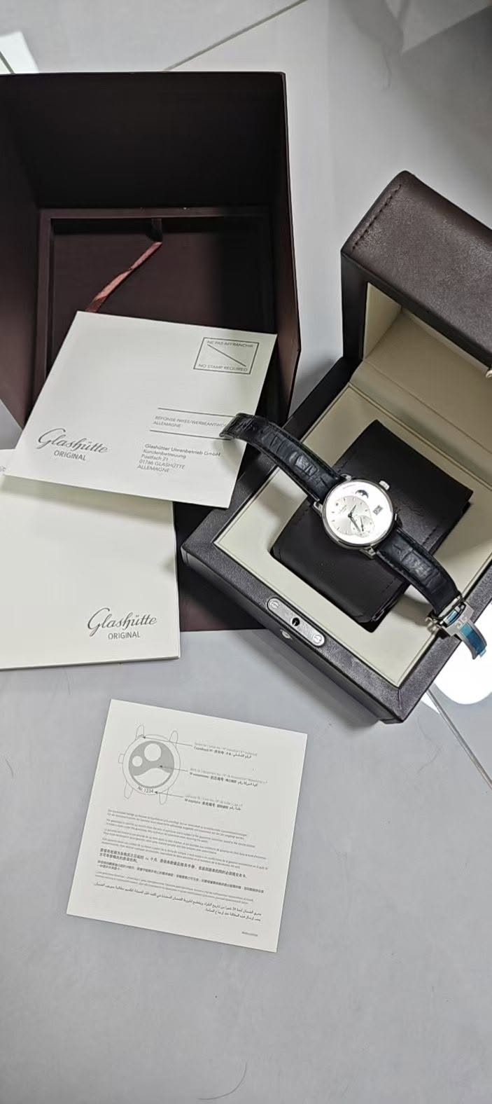 May be an image of wrist watch, fragrance and text