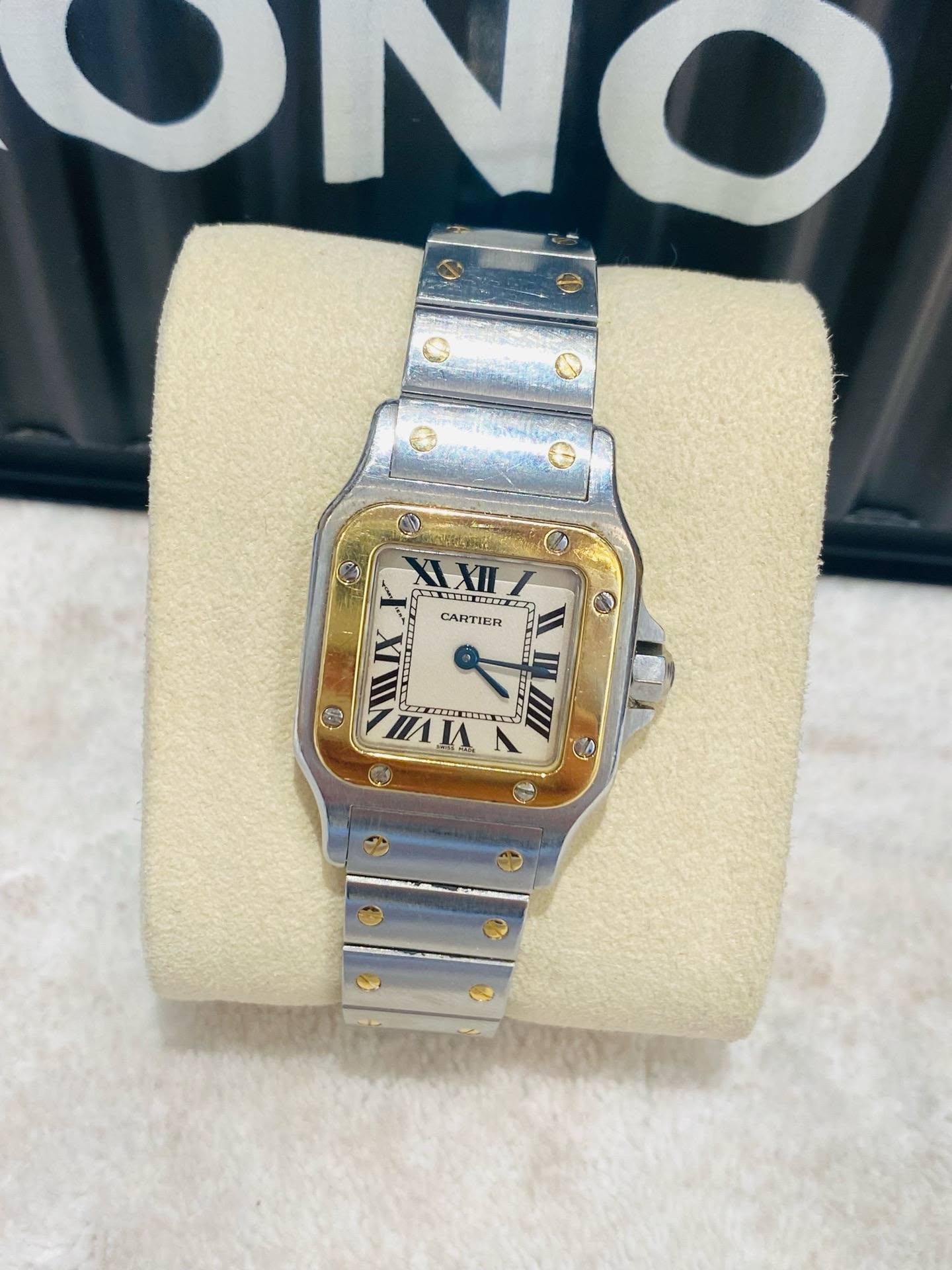 May be an image of wrist watch and text