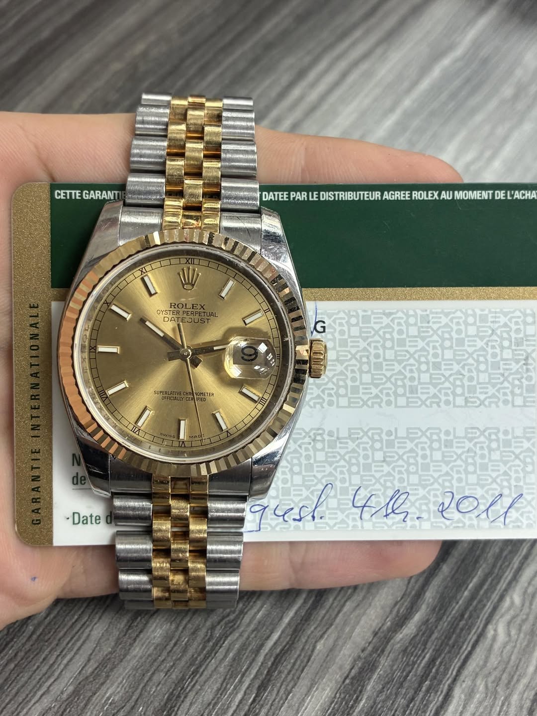May be an image of wrist watch and text
