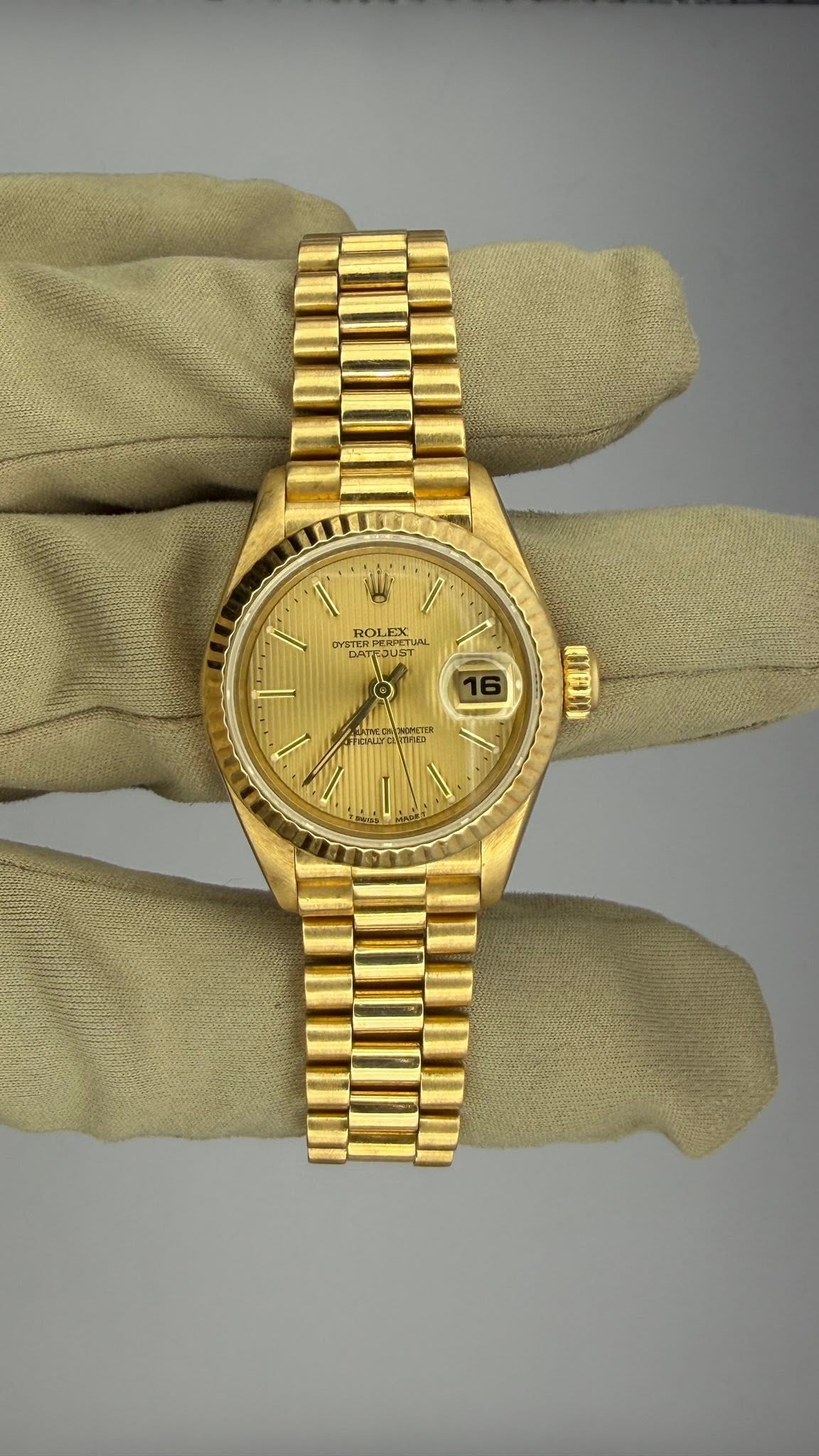 May be an image of wrist watch and text