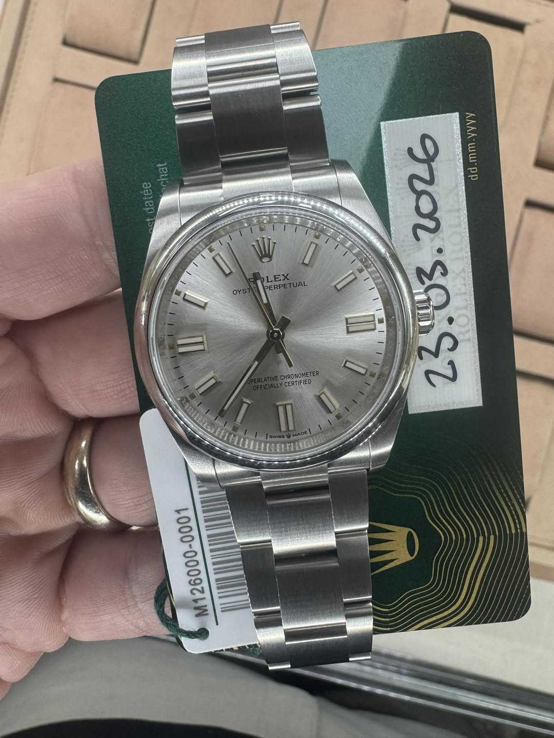 May be an image of wrist watch and text