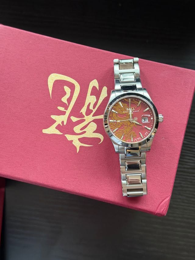 May be an image of wrist watch and text