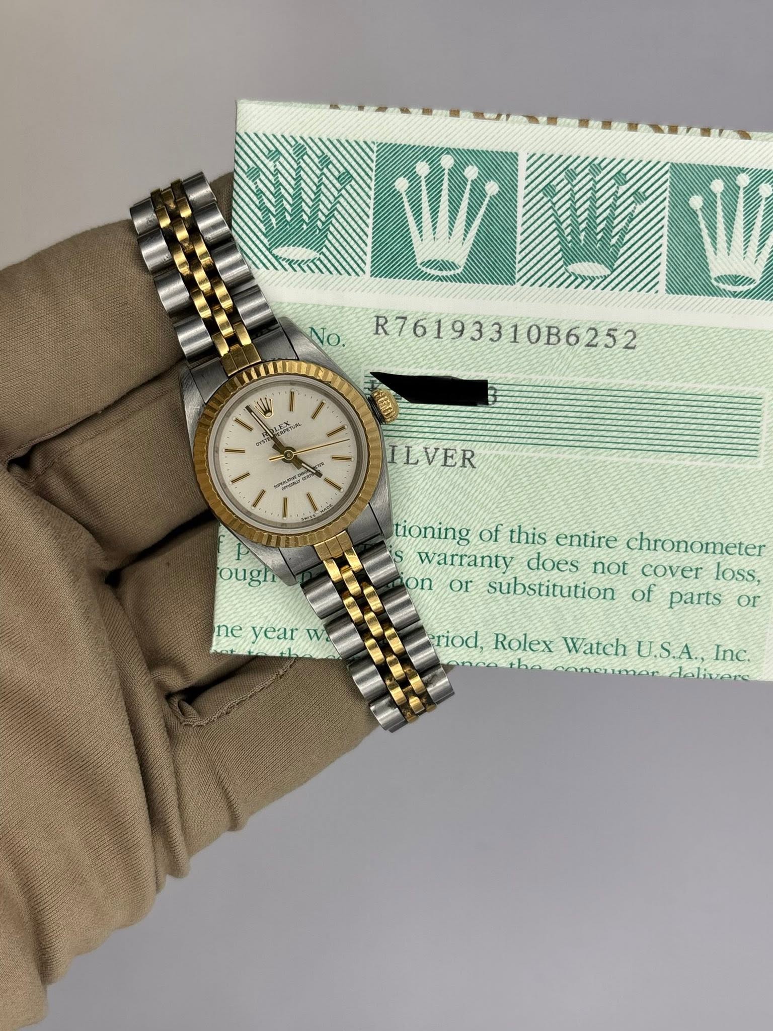 May be an image of wrist watch and text that says 'No. R76193310B6252 壹业面 SMETA ILVER ough ne vear neyeaT W tioning of this entire chronometer warranty does not cover loss, on or…