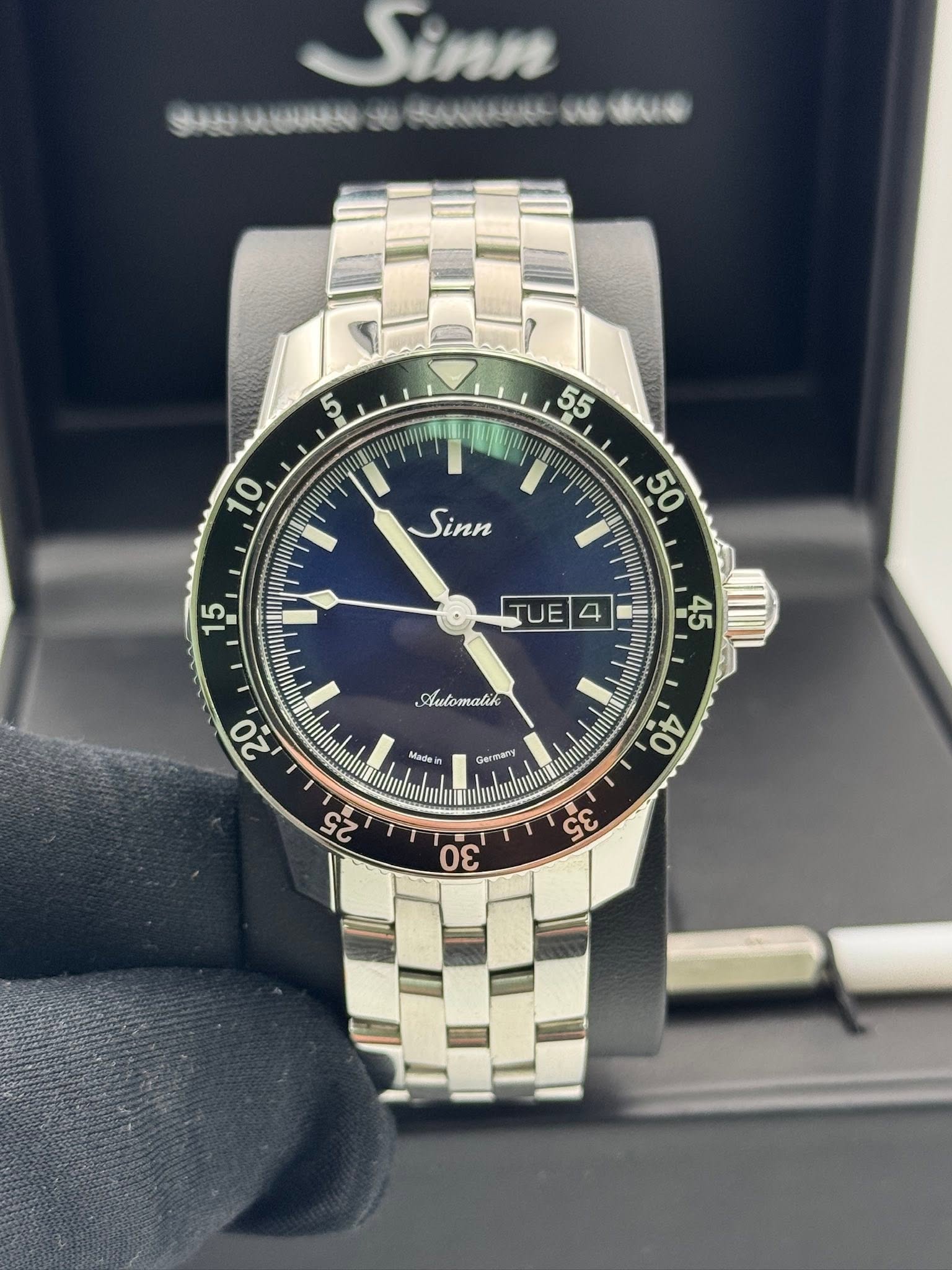 May be an image of wrist watch and text