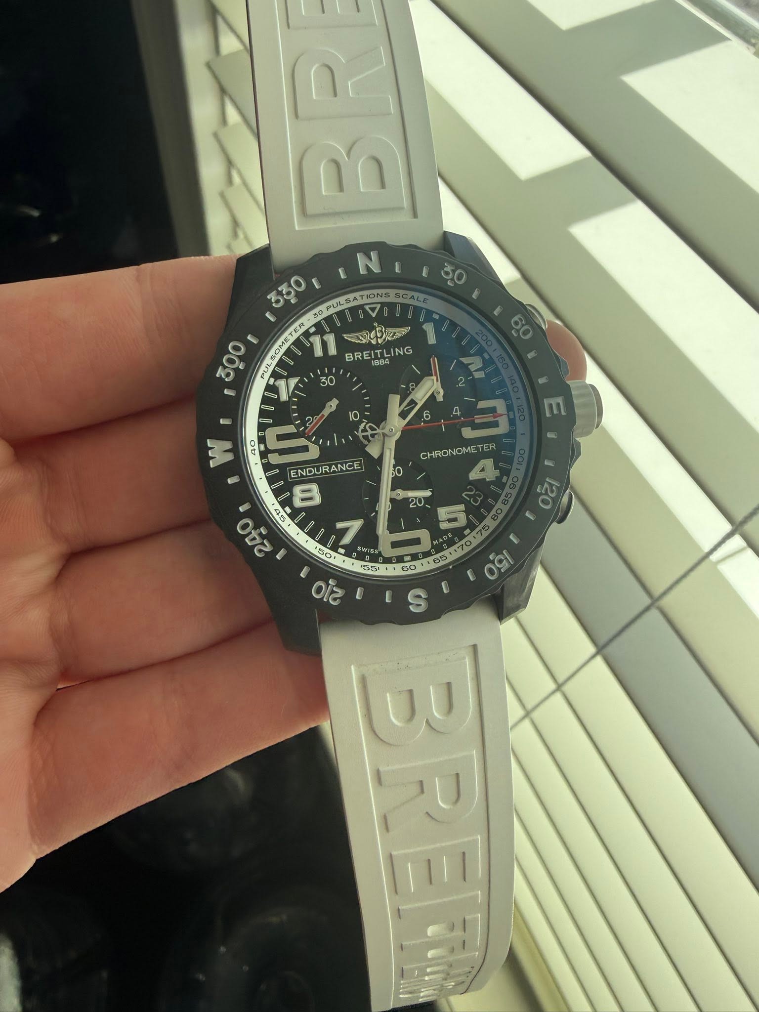 May be an image of digital watch and text that says 'Be ח'ם N 330 PULSATIO ONS BCACE 30 300 PUL I 30 SOMETE TER 11 বাইছা BR い% BREITLING EITL ING 4O ហ ENDURANCE 8 240 Οε 7 50. O…