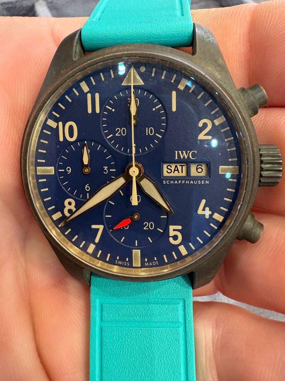 May be an image of wrist watch and text that says ' ၈ 3 2 IWC SAT SCHAFFHAUSEN 6 8 1 / 20 I 20-5 ١ 5 SWISS SS MADE'