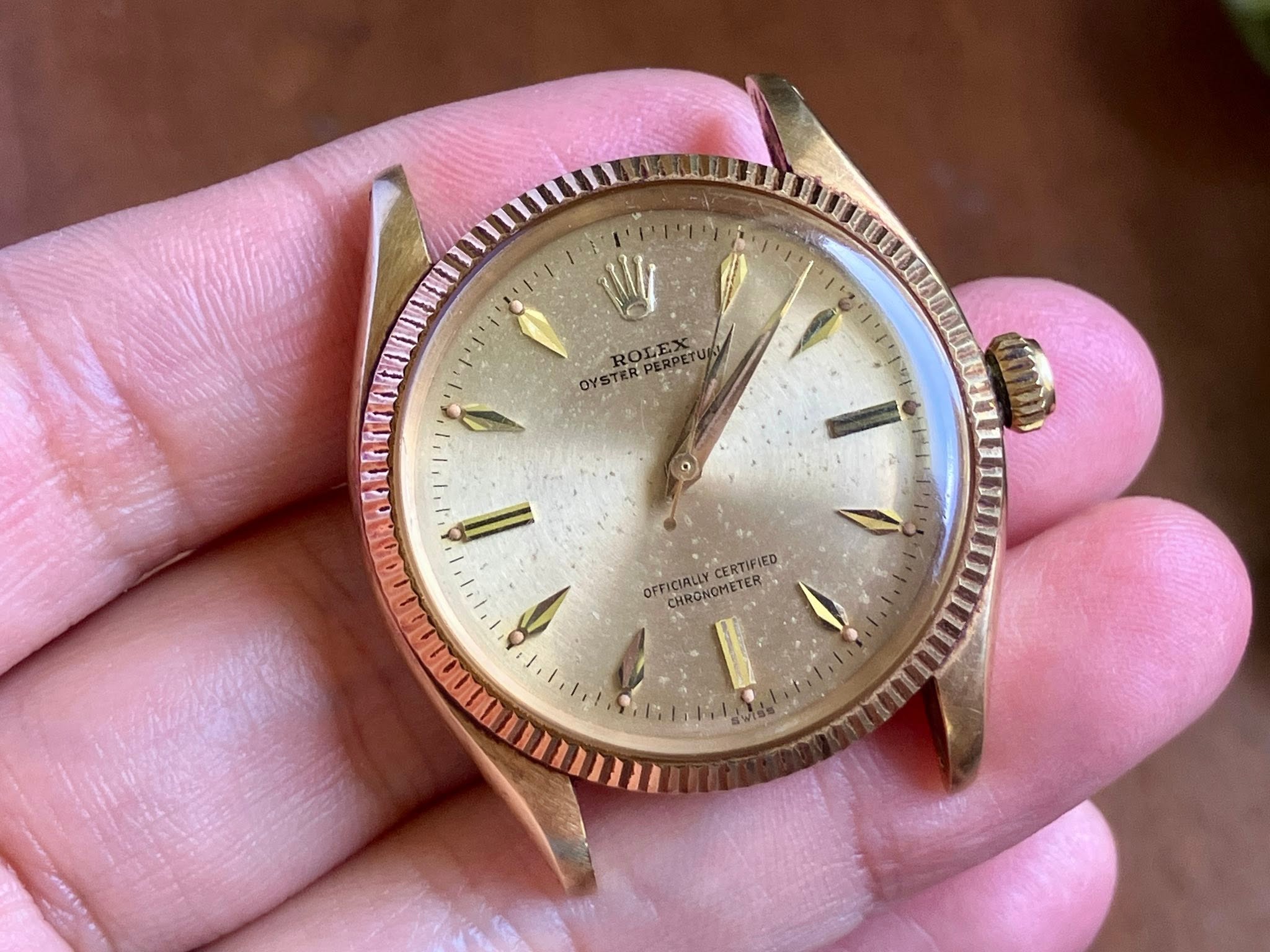 May be an image of wrist watch and text that says 'F'1 1' W OYSTERPERPETU ROLE OYSTERP OFFICIALLY OFFICIALCERTIFIED CHRONOMETER CERTIFIED မမ ای'