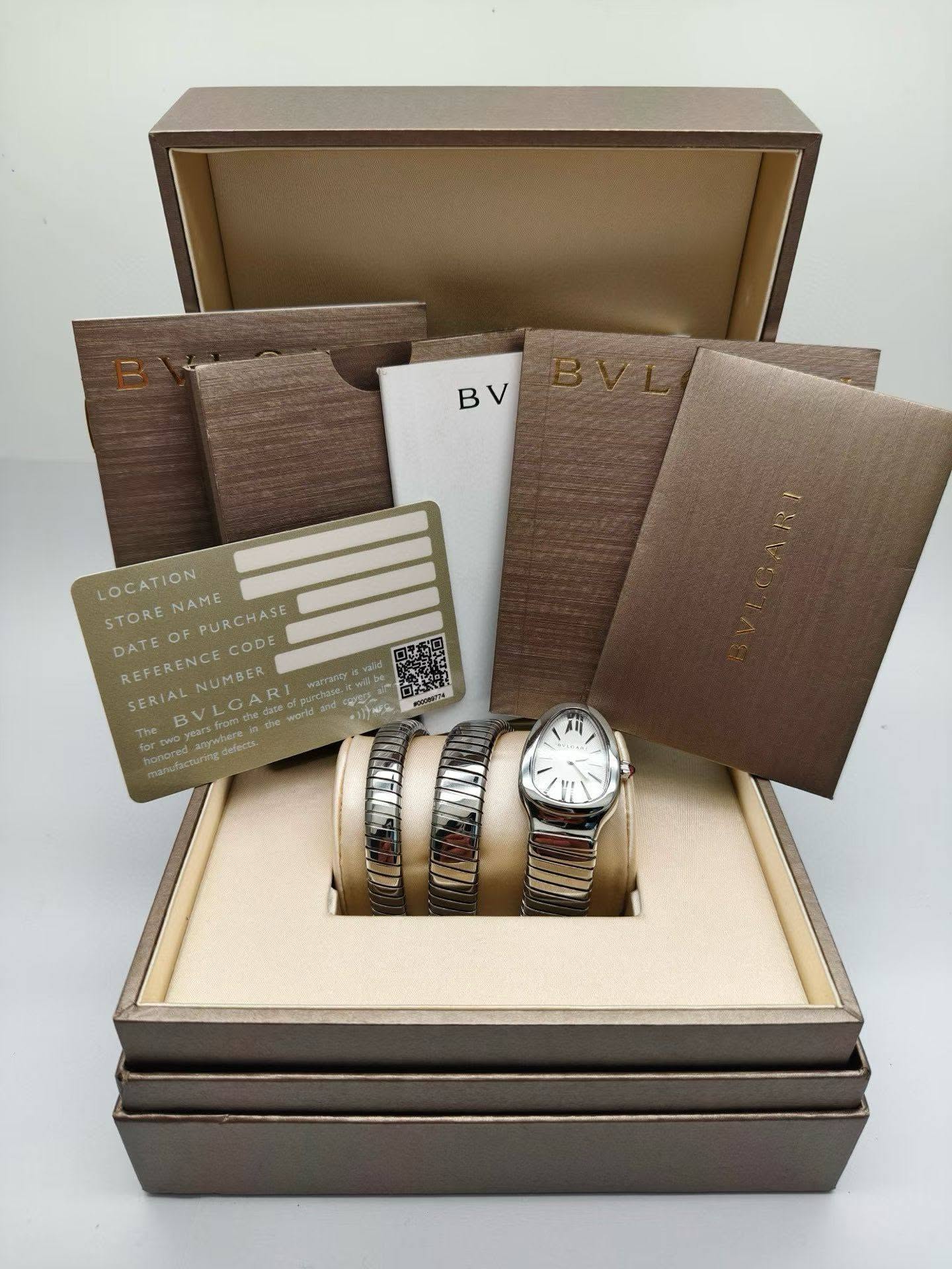 May be an image of cufflinks, napkin ring, wrist watch and text