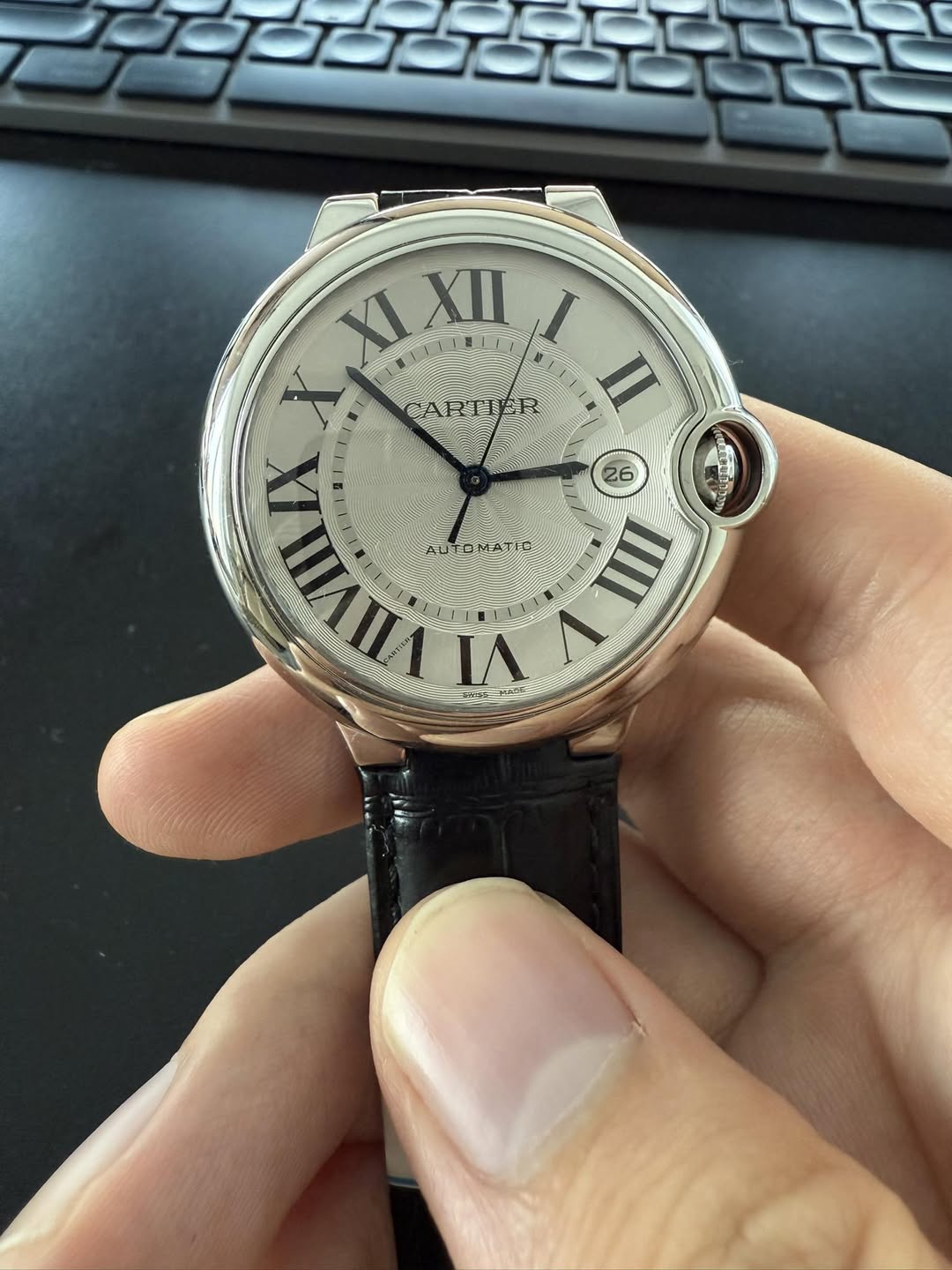 May be an image of wrist watch and text