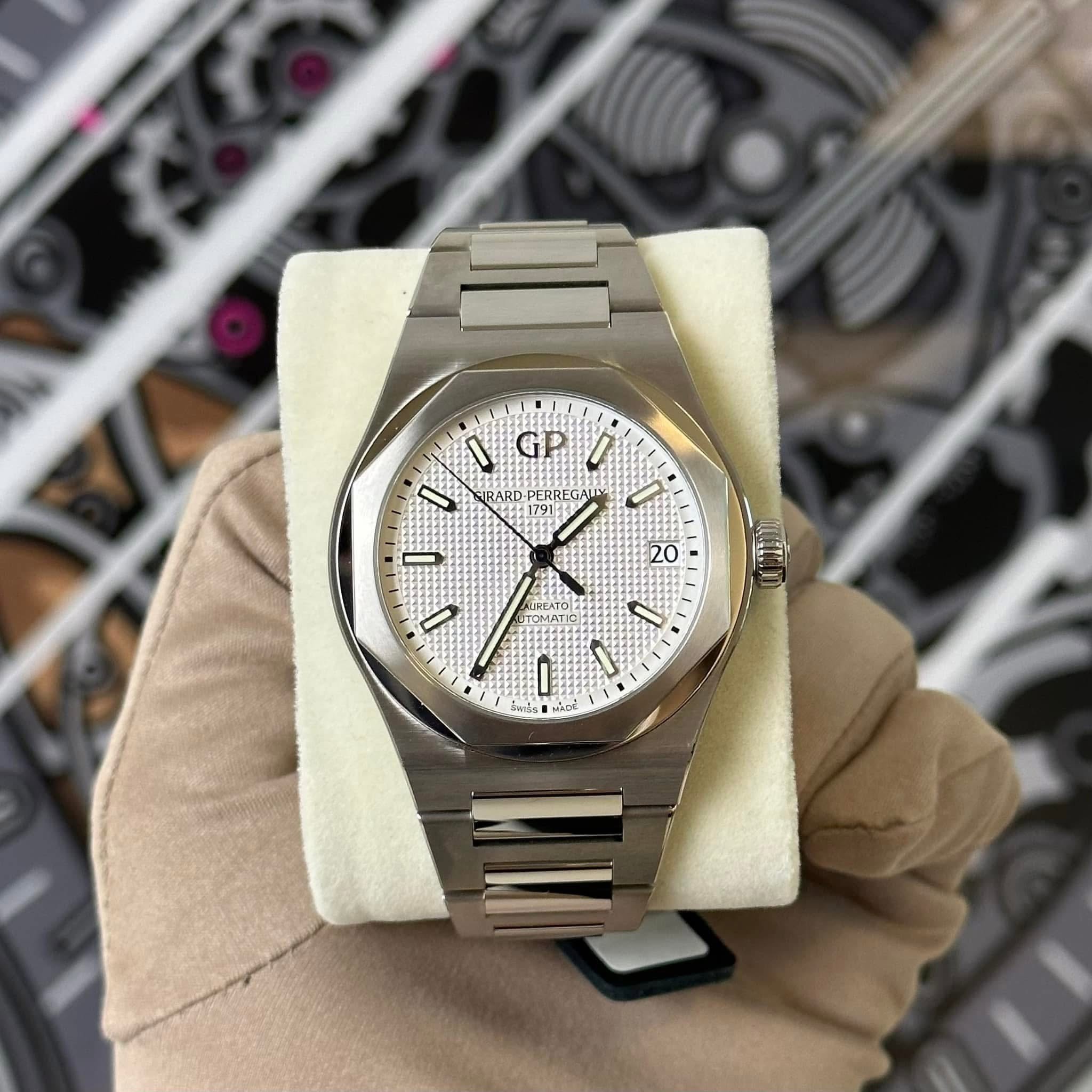 May be an image of wrist watch and text that says 'I GP 1 I ARD PERREGAL L ERREG I 2 20 TOMATI ل۱ • - 0 mls ๕'