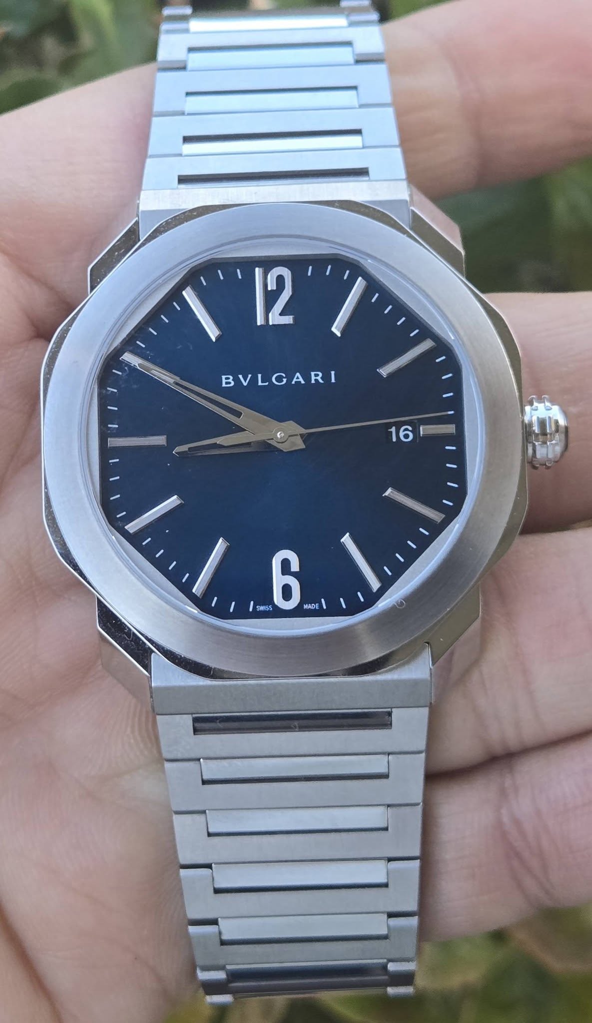 May be an image of wrist watch and text