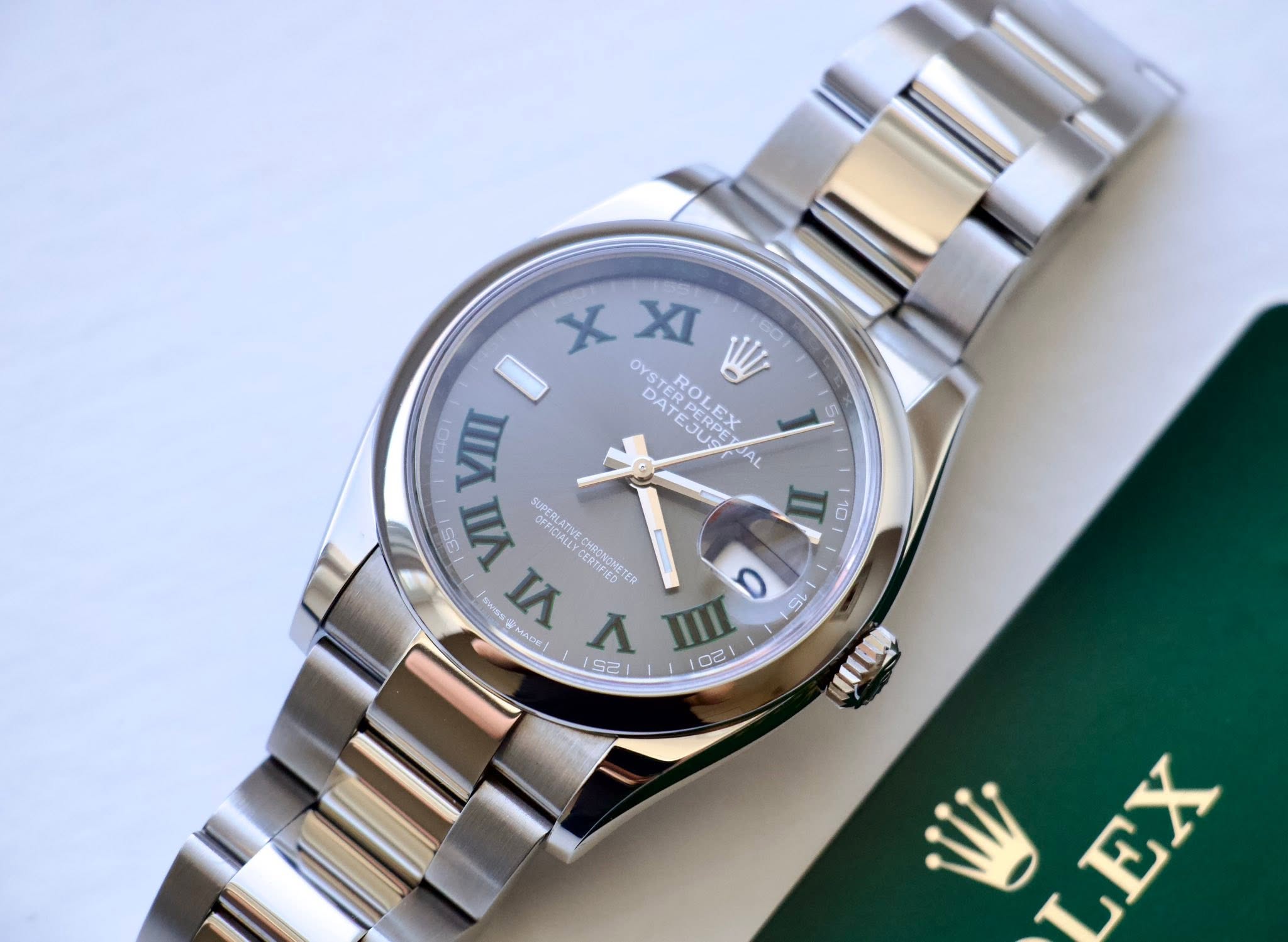 May be an image of wrist watch and text