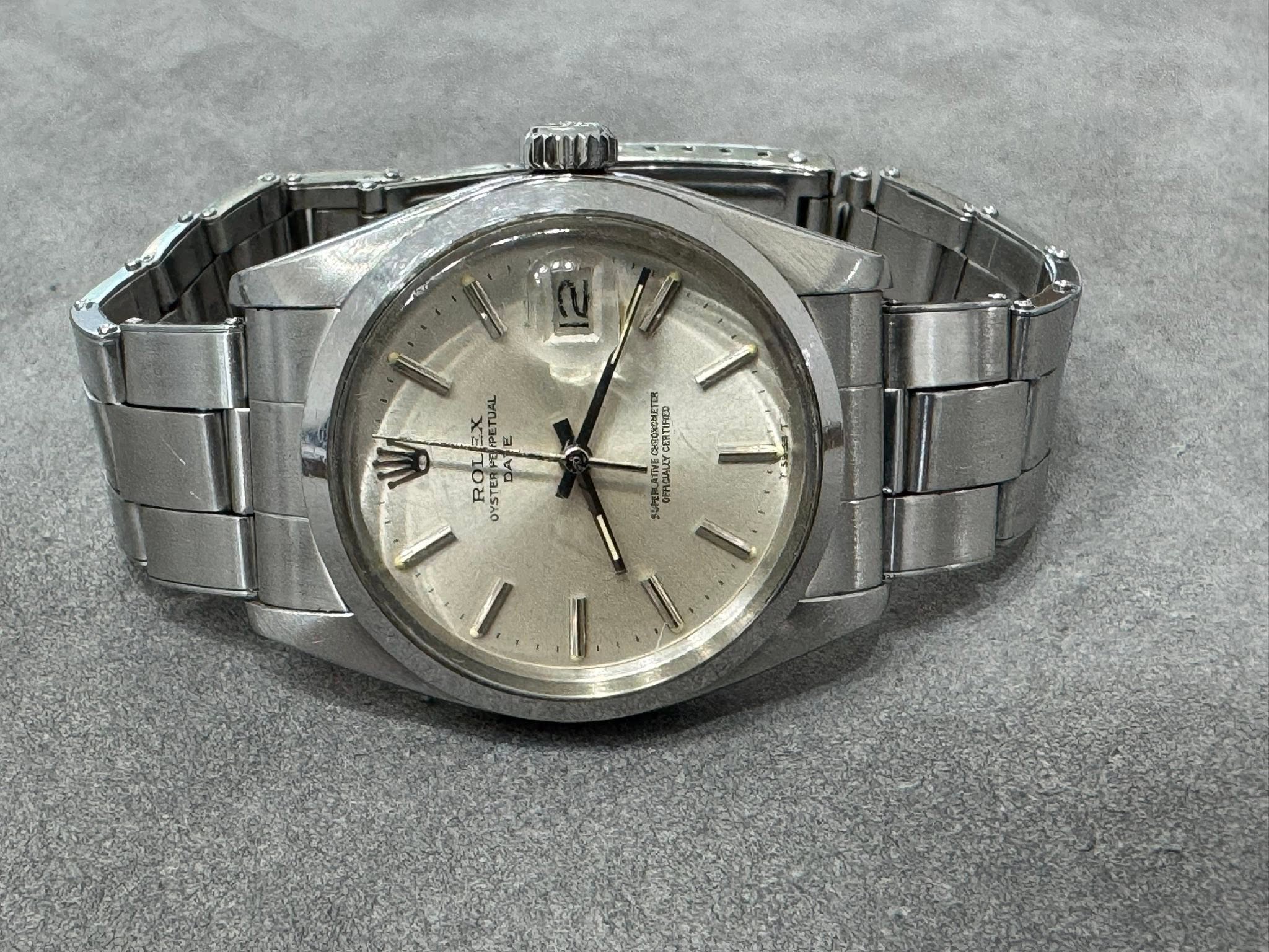 May be an image of wrist watch and text