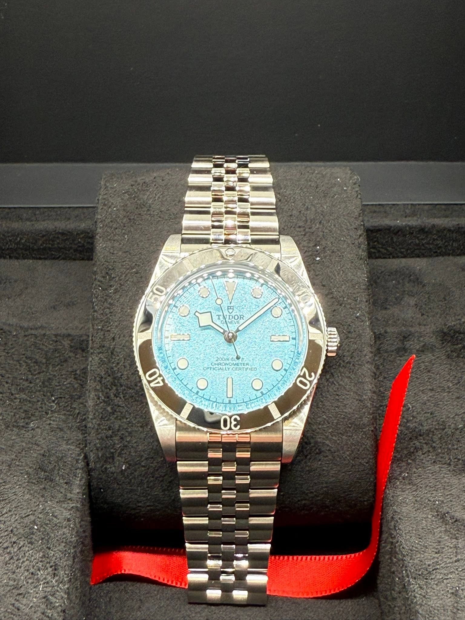 May be an image of wrist watch and text