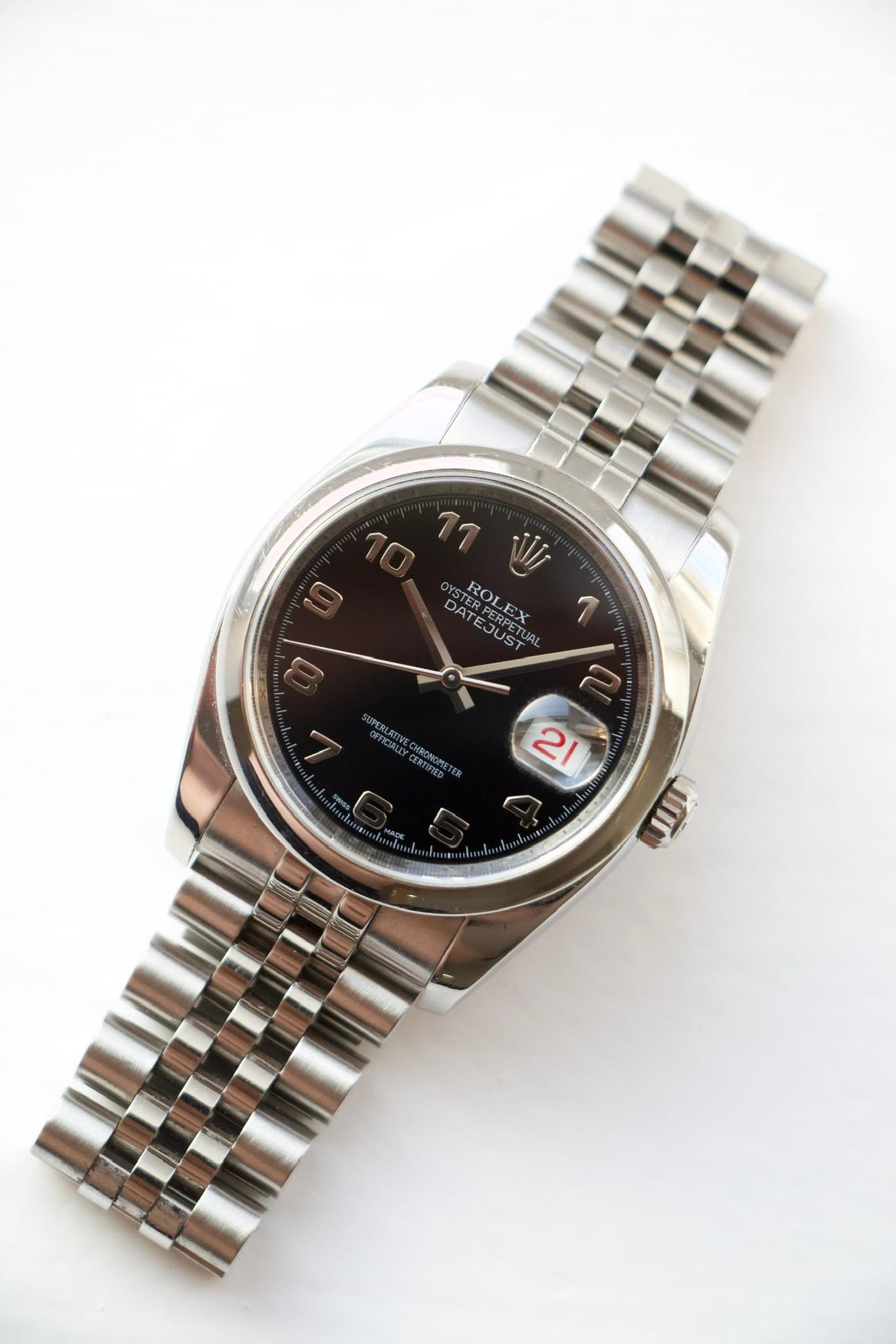 May be an image of wrist watch and text that says '10 11 WI PTER ROLEX AT ATERPETU DATEJUST DAT ERPER ROLEX E A71 JUST 1 2 21 自 JII'