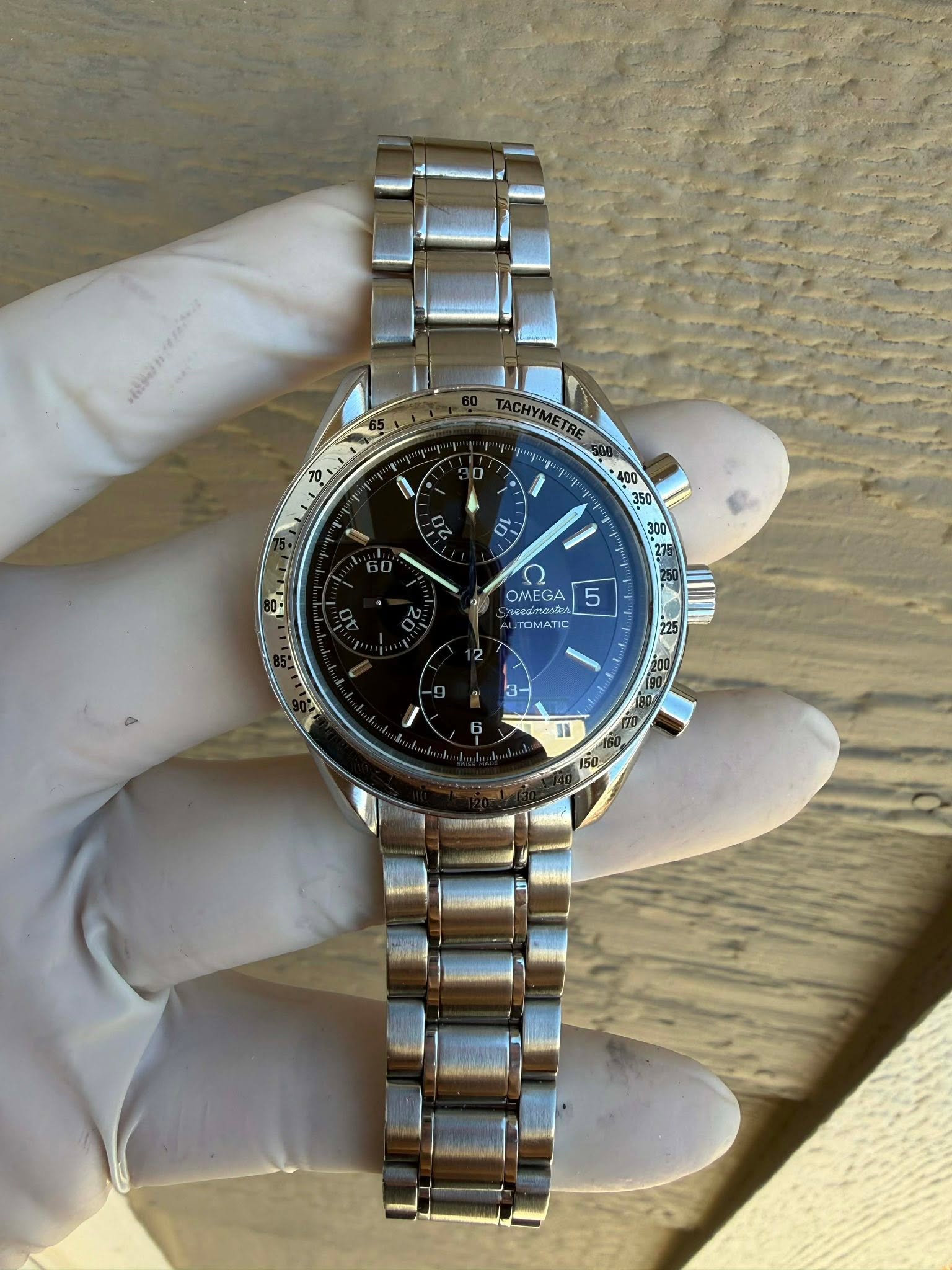May be an image of wrist watch and text
