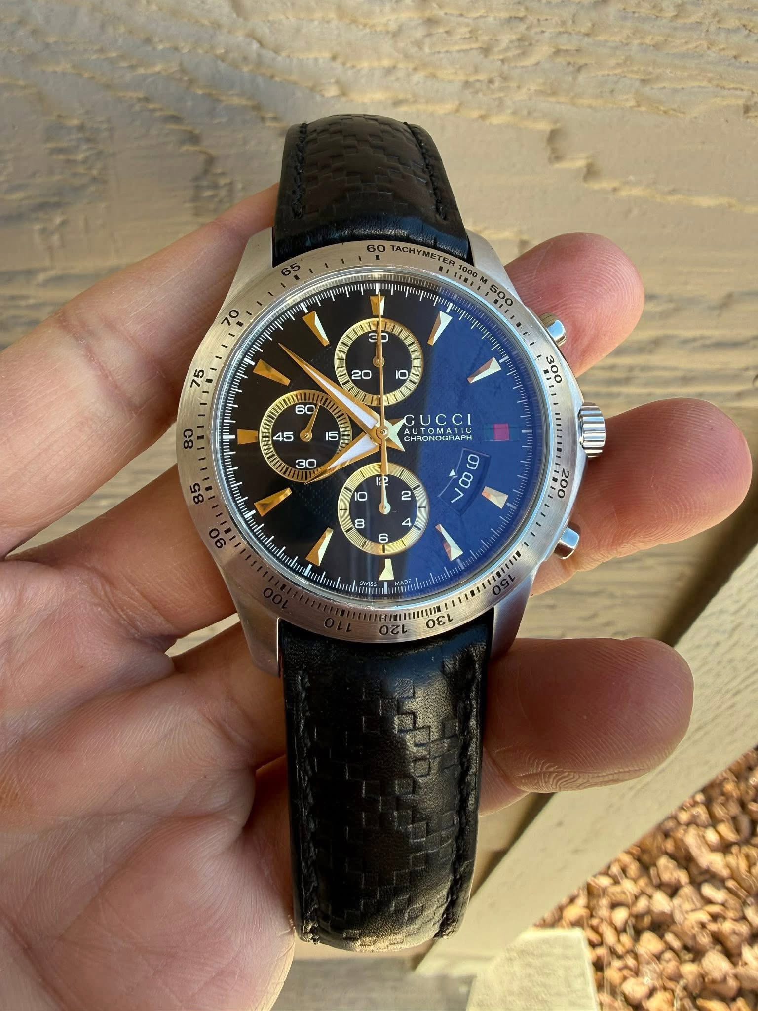 May be an image of wrist watch and text