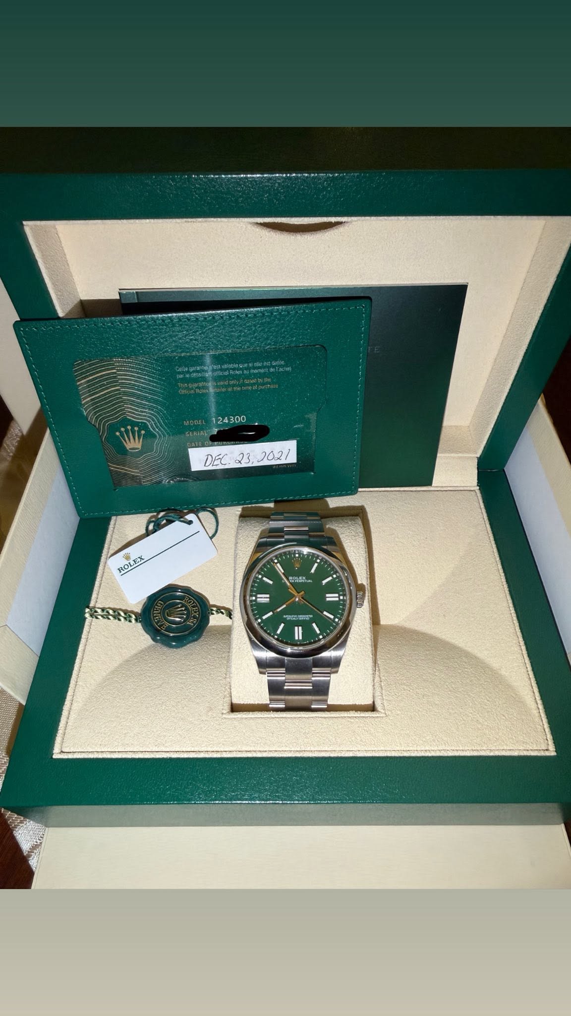 May be an image of wrist watch and text that says '124300 DEC DEC232621 23. 202/ ROLEX ROLe n II'