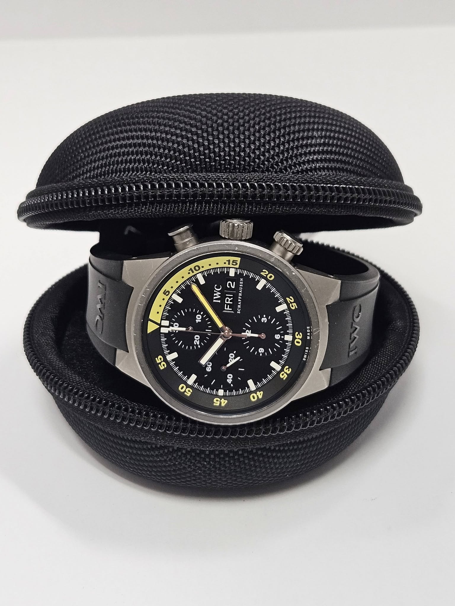 May be an image of wrist watch, leather and text