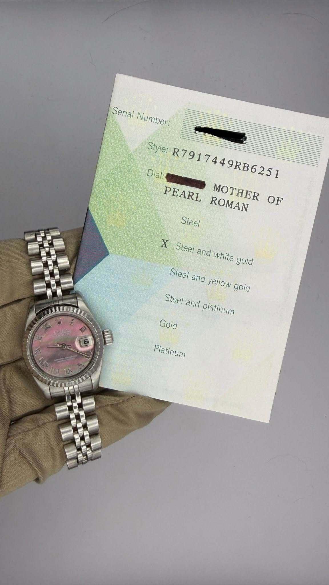 May be an image of wrist watch and text that says 'Serial Number: Number: Style: R7917449RB6251 Dial: PEARL MOTHER OF ROMAN Steel X Steel and white gold Steel and yellow gold Steel…