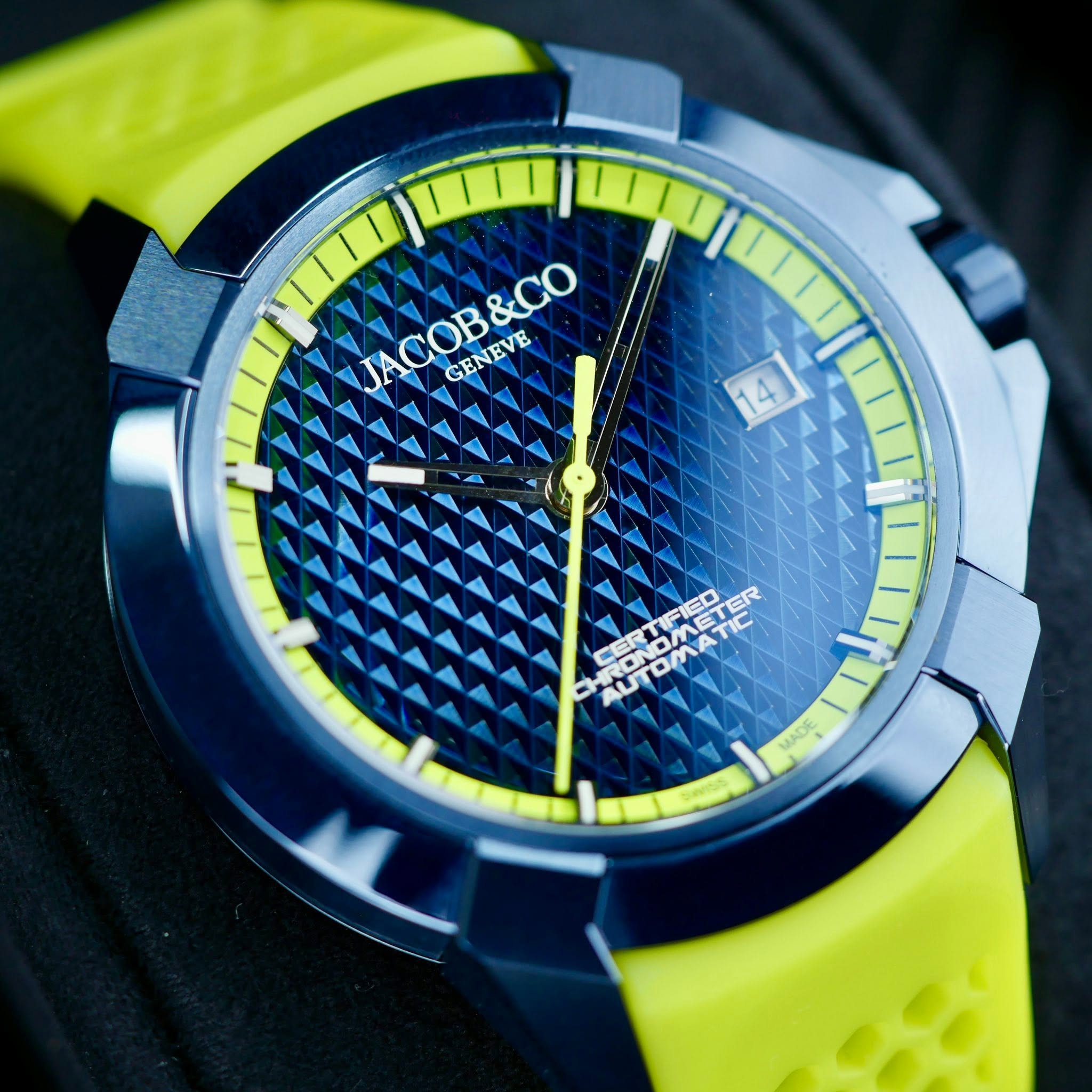 May be an image of digital watch and text that says 'JACOB&CO &CO AB GENEVE TNOMETER חיו UTOMAETER ONMFIED Фc'