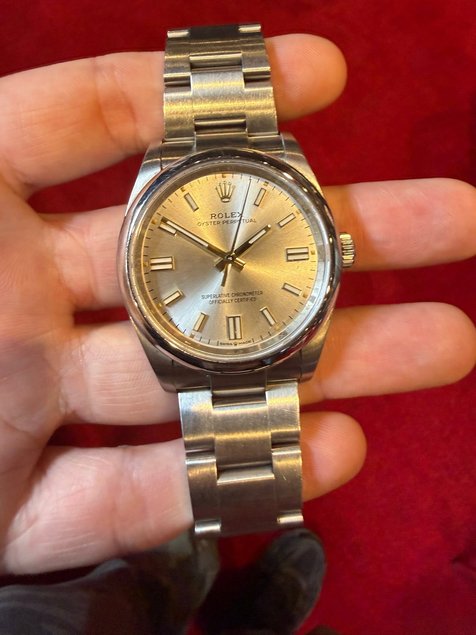 May be an image of wrist watch and text