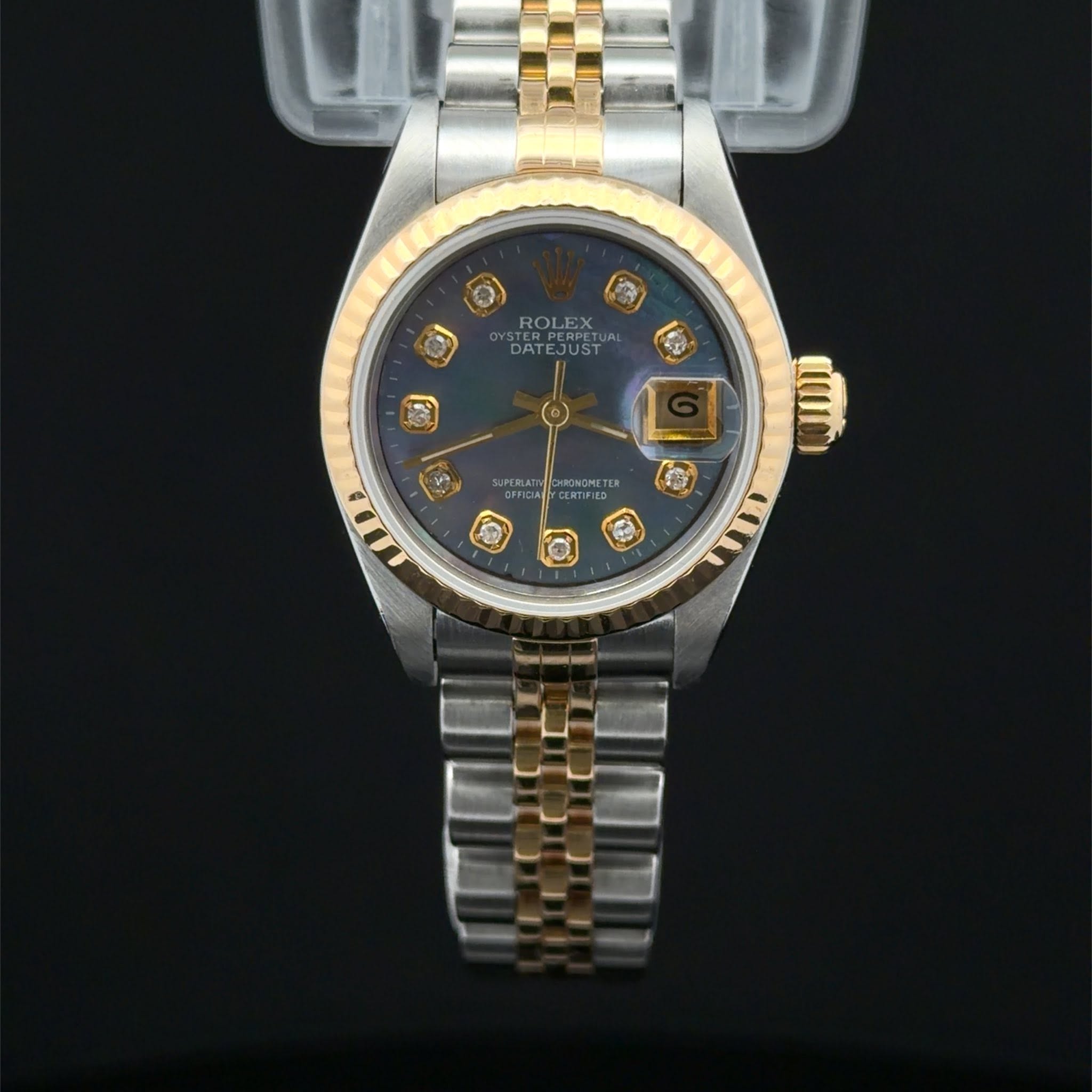 May be an image of wrist watch and text that says 'O (園 ROLEX X DATE DATEJUST JUST G CHRONGMETER ወሻ'