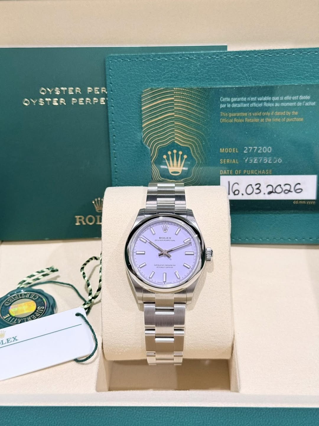 May be an image of wrist watch and text that says 'OYSTER PER OYSTERPERPE OYSTER PERPE Cette garantie sttearmerieeee n'est valable ques stelle elle est datée detaillanto officiel…