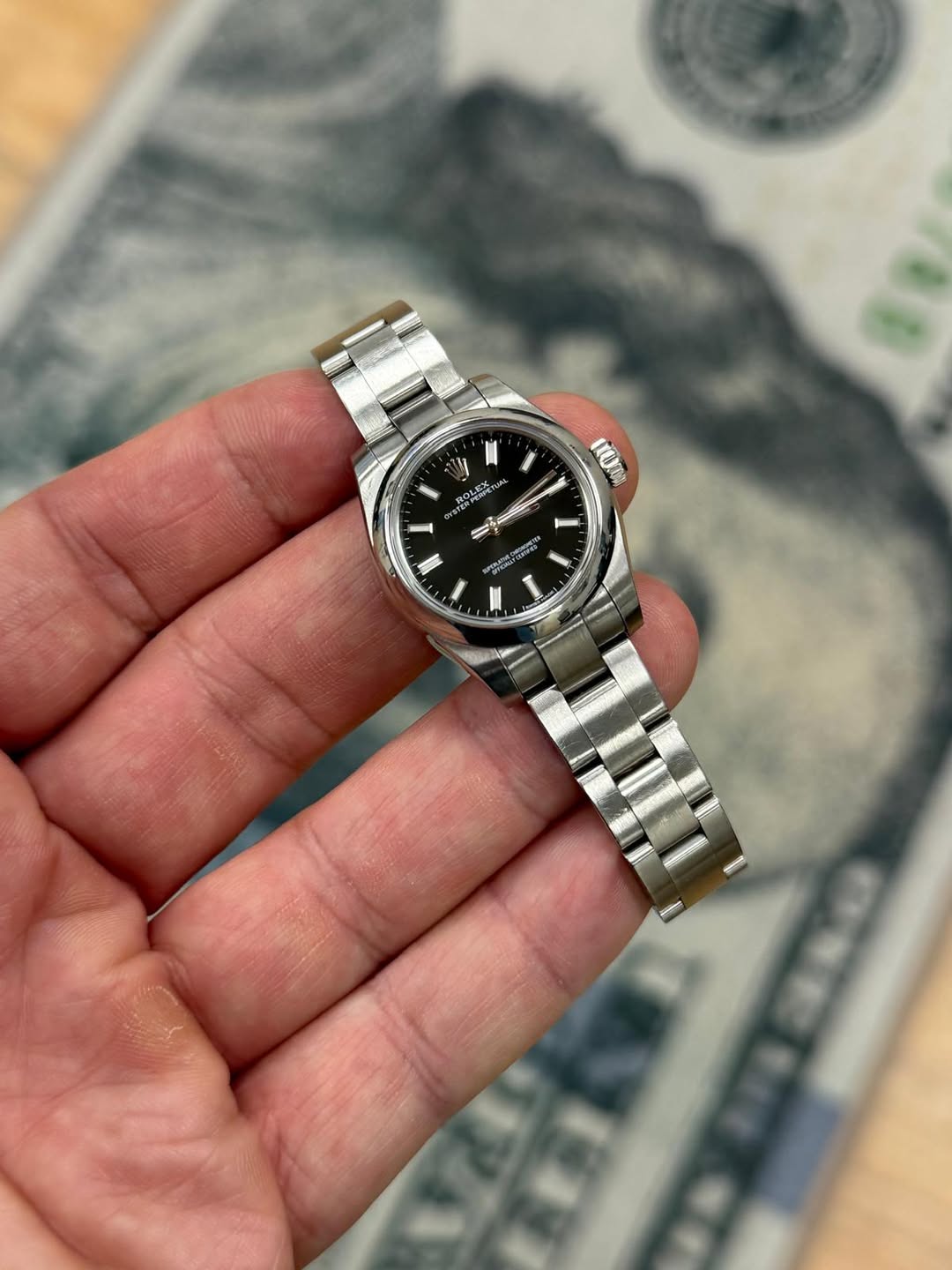 May be an image of wrist watch and text