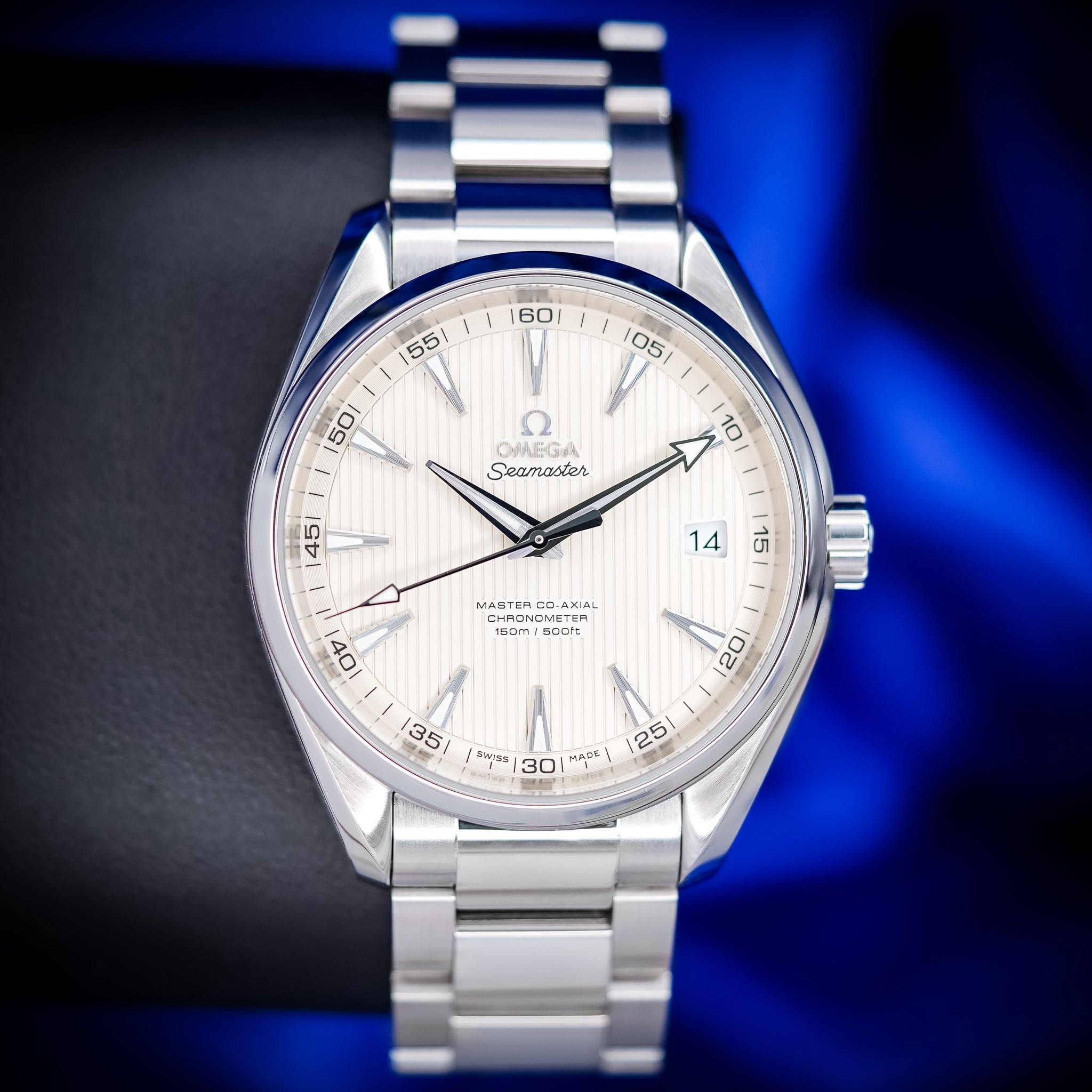May be an image of wrist watch and text that says ' OHAEGA Seamaster MASTER CC COrA AXIAL CHRON 150m 5o0't 150m oV 20 35 5 SWINS 30 MApE 25'
