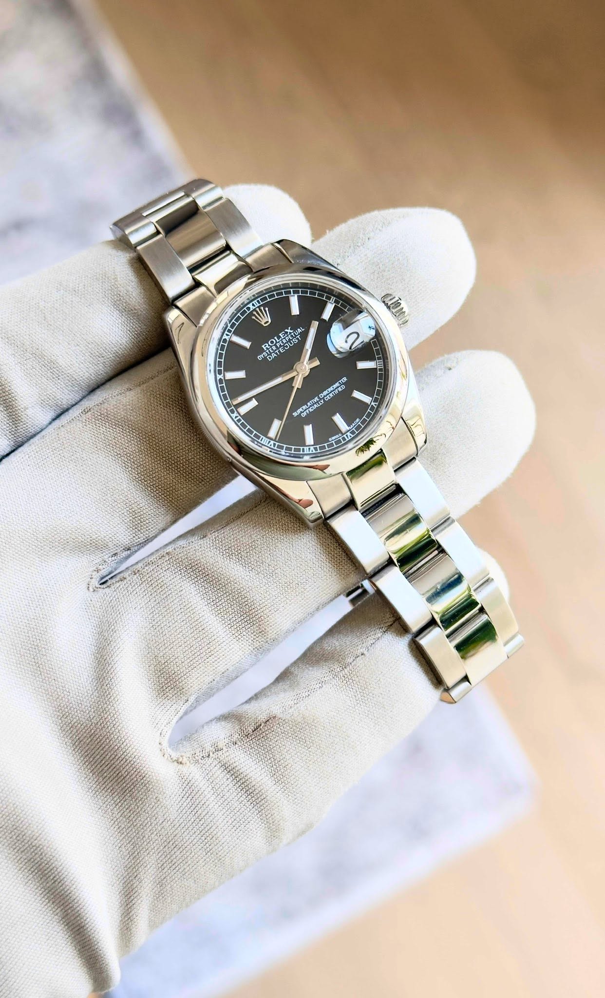 May be an image of wrist watch and text